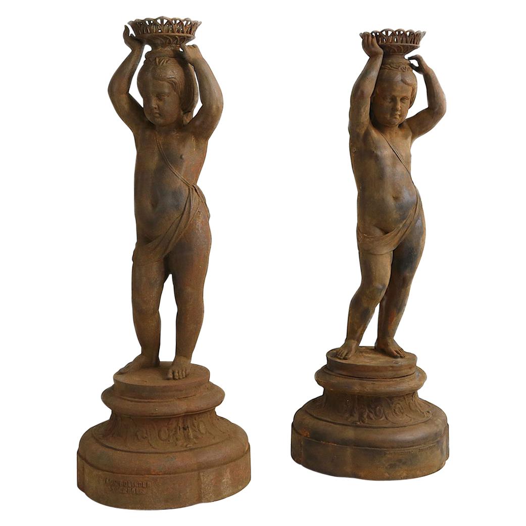 Pair of Cast Iron Girl on Plinths with a Stockholm Foundry Stamp For Sale
