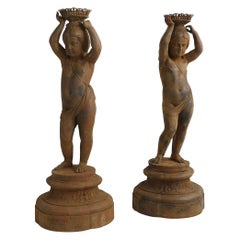 Pair of Cast Iron Girl on Plinths with a Stockholm Foundry Stamp