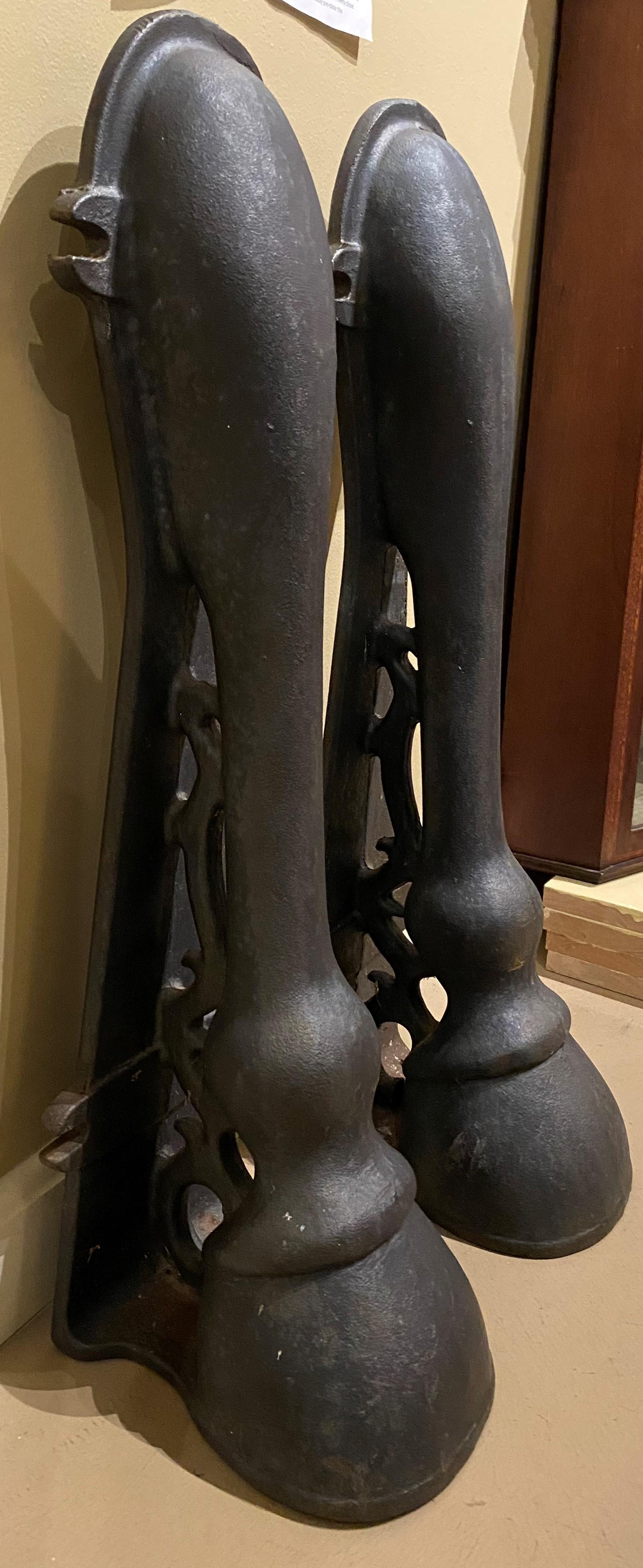 A fine pair of unusual form cast iron horse leg building fenders or carriage guides attributed to William Adams, a Philadelphia iron worker (b.1833). Adams, who after being in partnership under the name Williams & Storrie Iron Foundry in the late