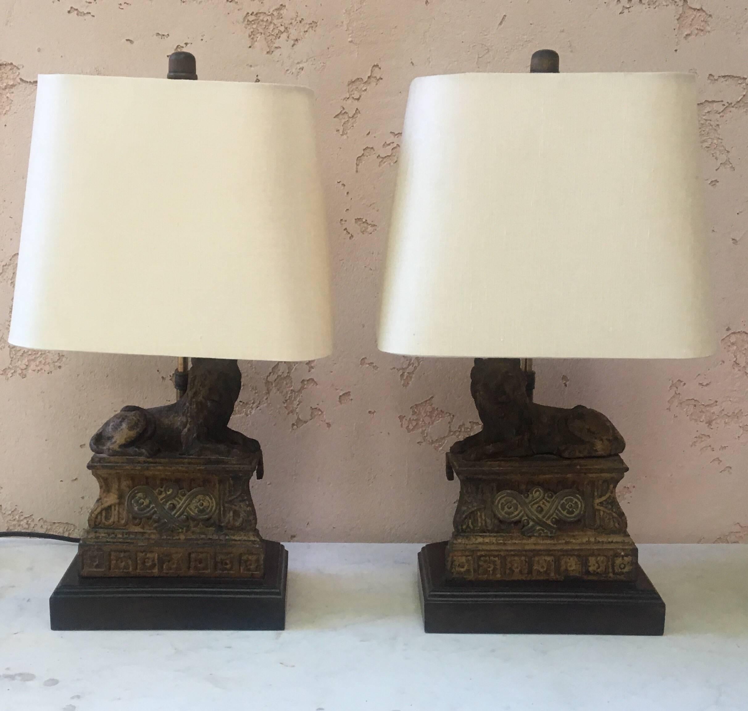 Pair of table lamps made with 19th century French cast iron lions.
Wired for US use and in working conditions.
Ecru linen shades included one is damaged.