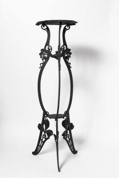 Pair of cast iron pedestals, art nouveau period. France, early 20th century.
