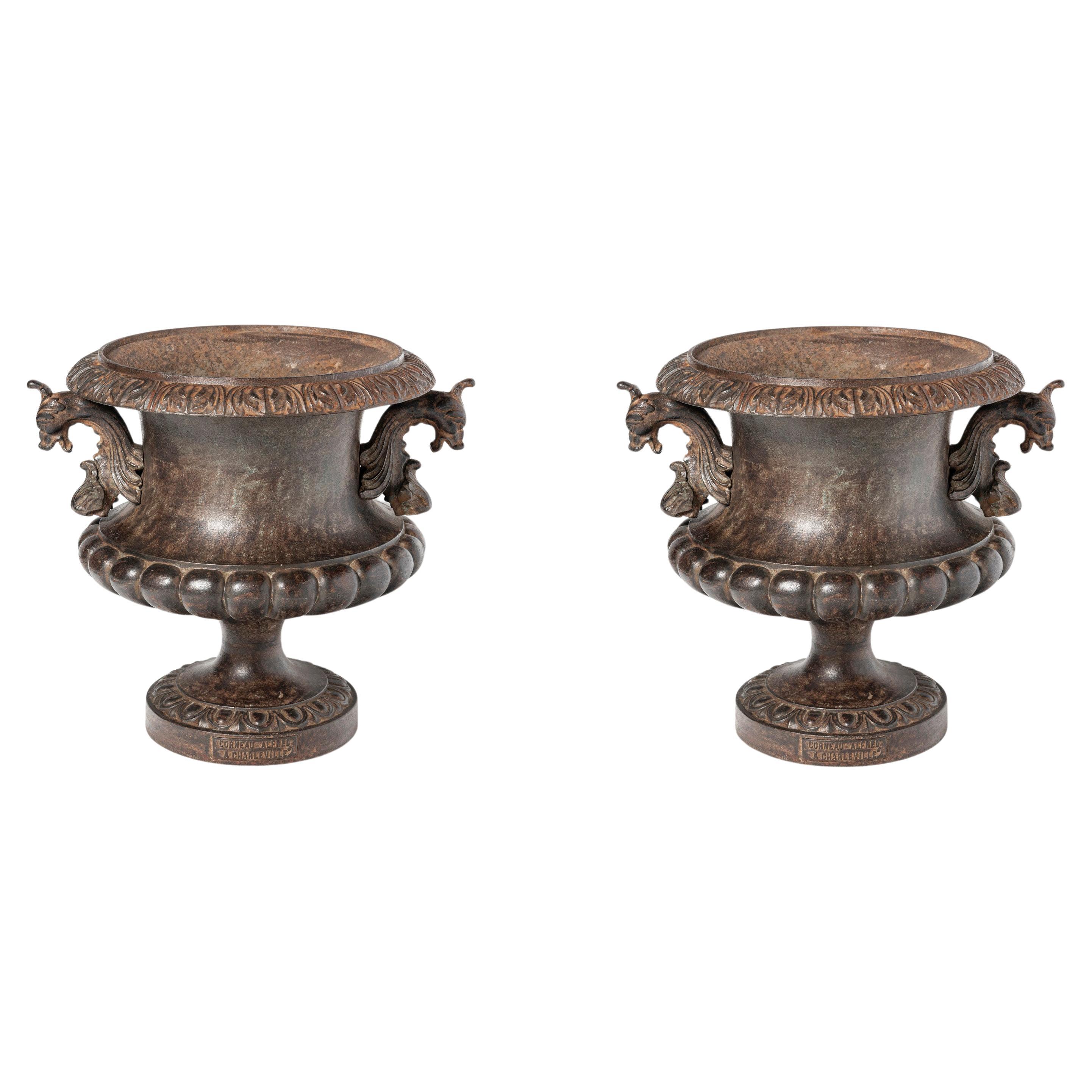 Pair of cast iron planters by Alfred Corneau. France, early 20th century.