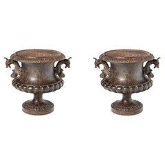 Pair of cast iron planters by Alfred Corneau. France, early 20th century.