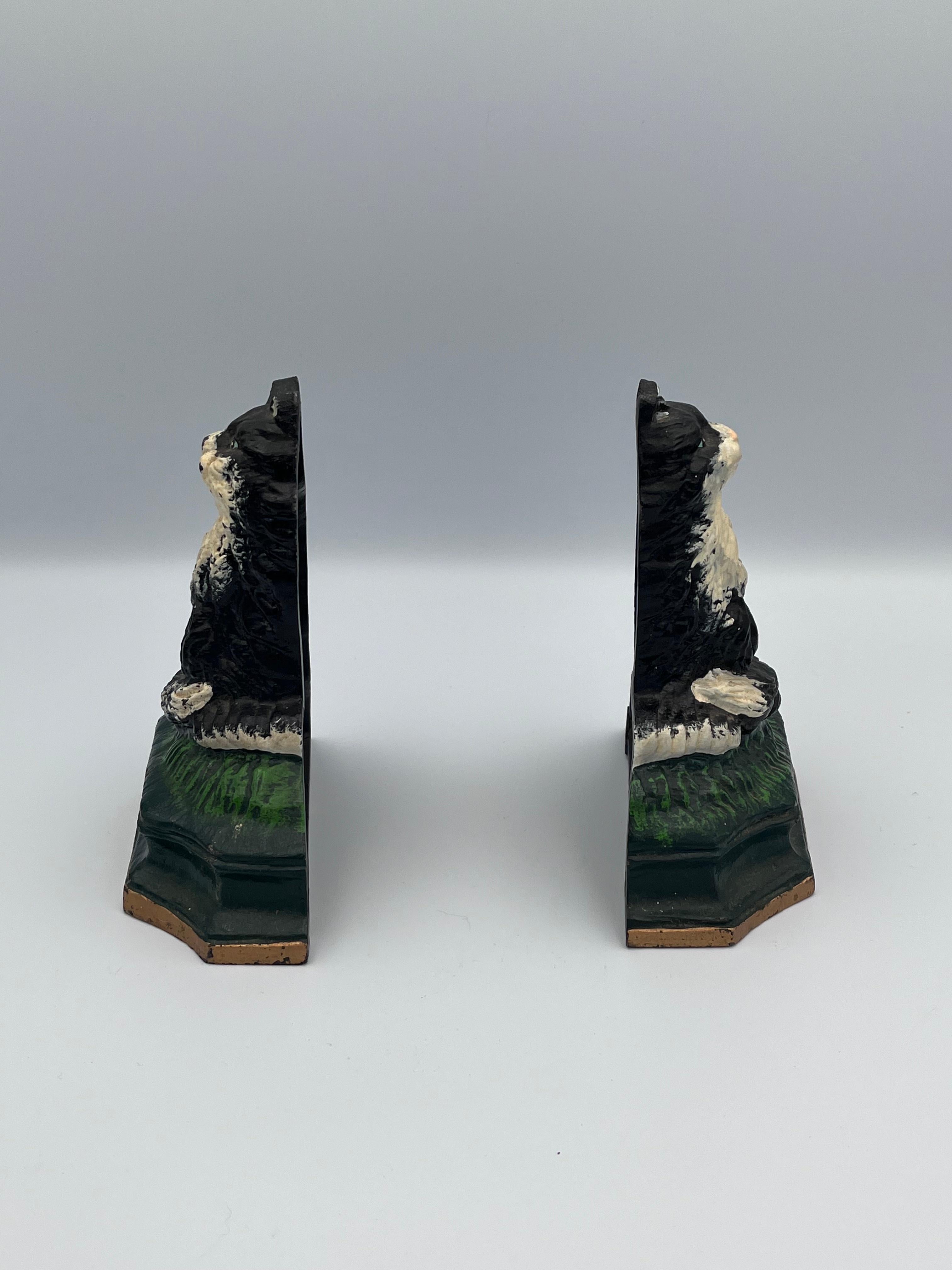 This charming pair of 20th-century cast iron tuxedo cat bookends captures the elegance and playfulness of these beloved felines. Heavy for their size, they provide excellent stability, making them not only stylish bookends but also highly functional