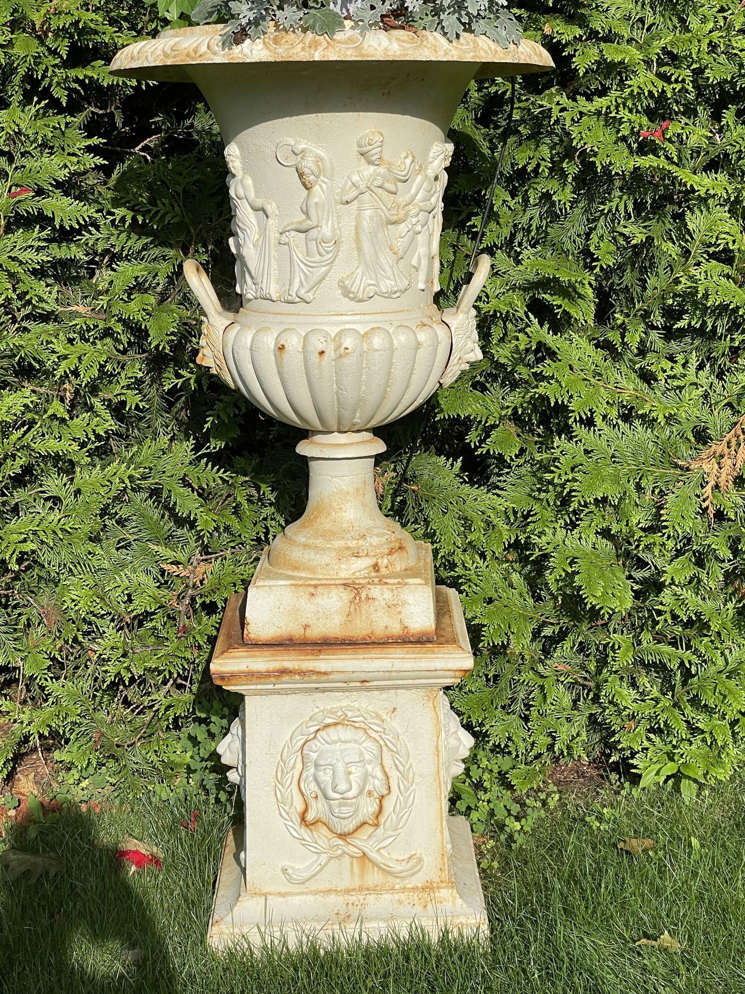 Pair of Cast Iron Urn or Planters or Jardinières
 
A stunning pair of Neoclassical Urn or Planters on Pedestal Bases. Direct from a New Canaan CT Mansion of an Lady come this stunning pair of Garden Urns. Each massive urn sits upon a pedestal base