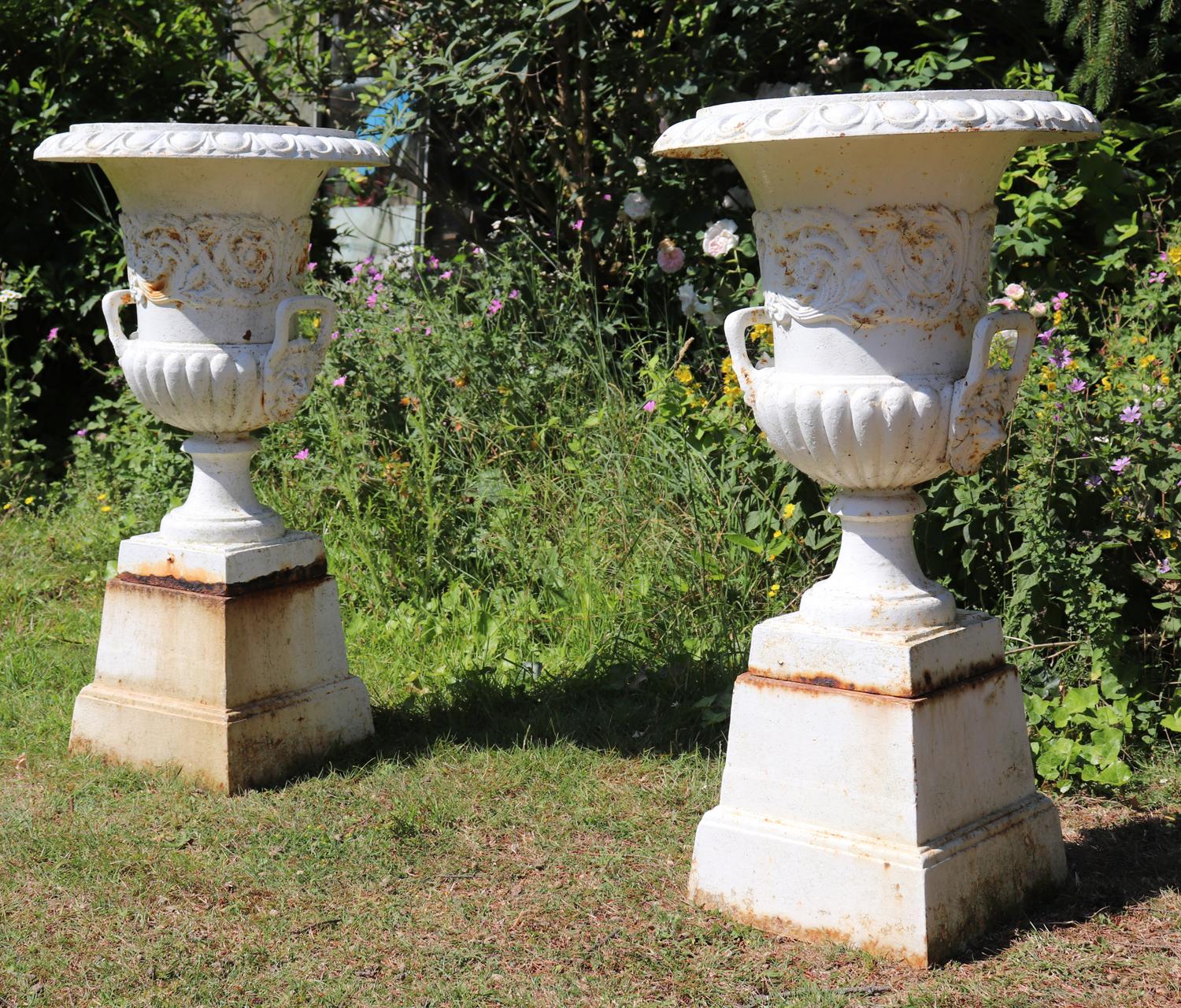 Other Pair of Cast Iron Urns on Plinth