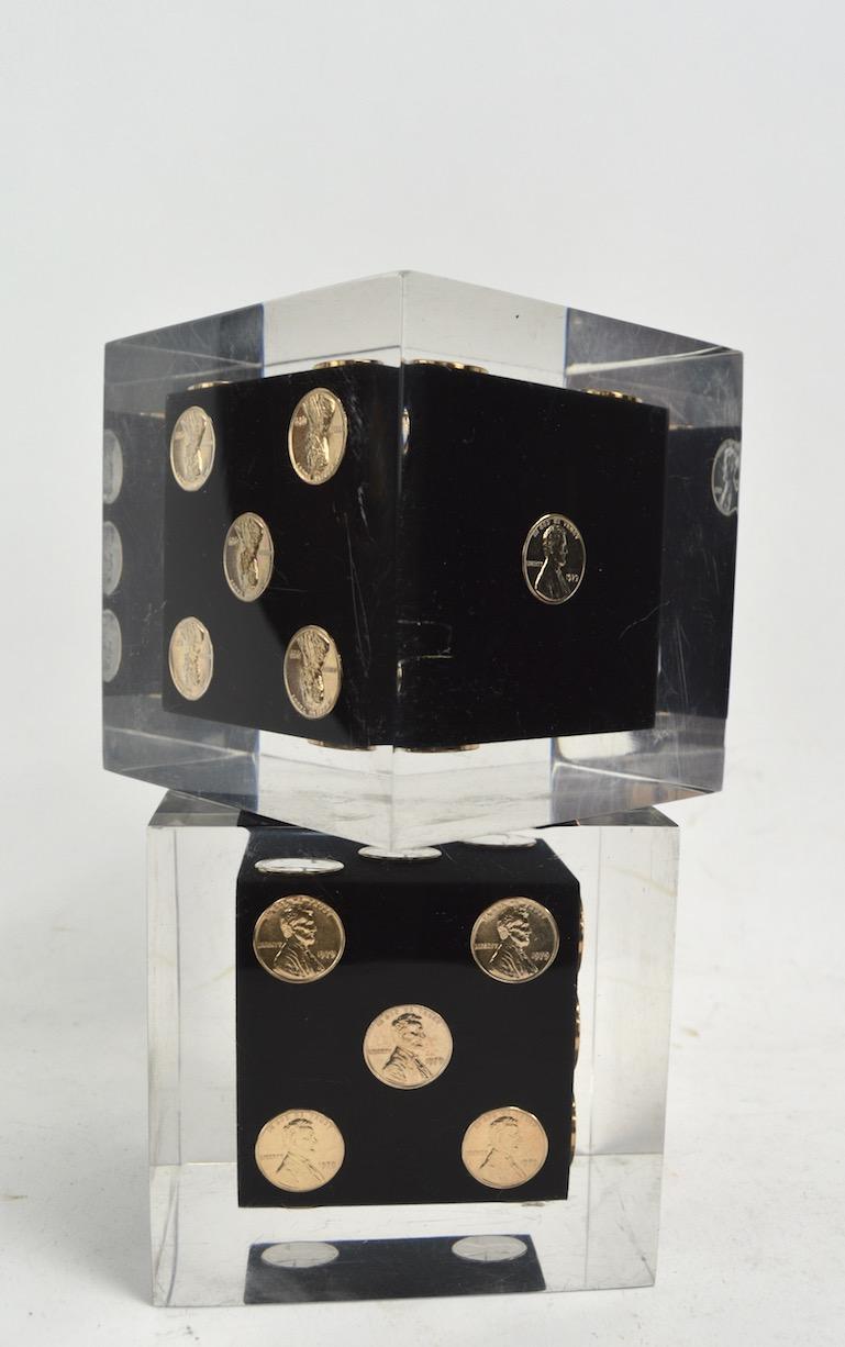 Cool and Chic Lucite dice clear, with black interior and copper pennies (1979). Originally designed as bookends, great as decorative objects, paperweights, or small sculpture.