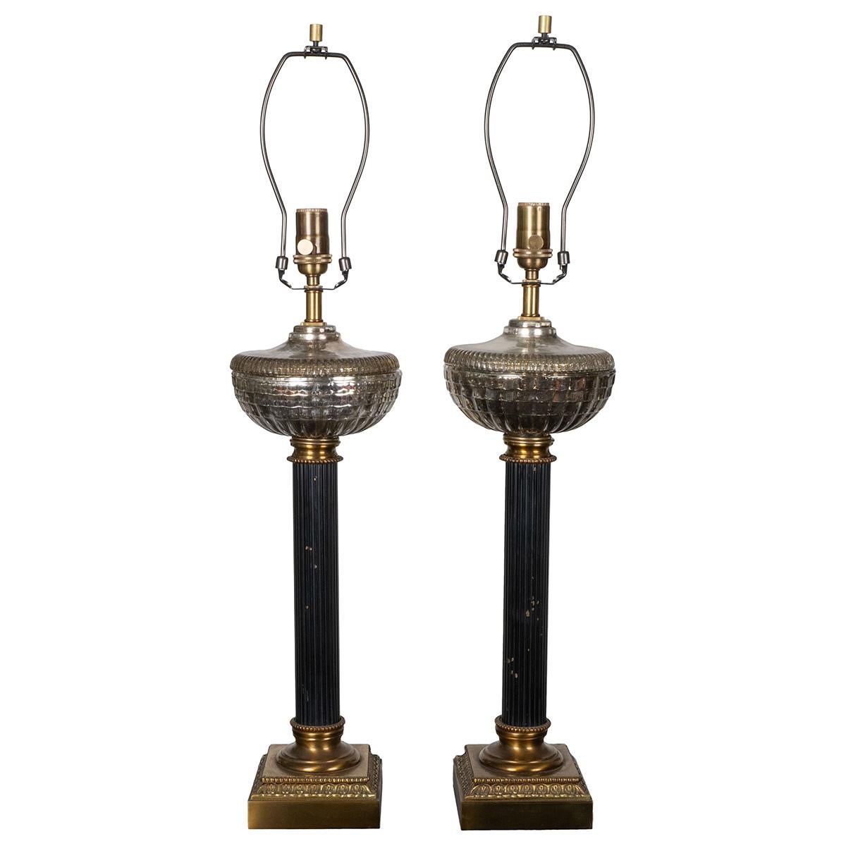Pair of enameled metal and brass neo-classical columnar table lamps featuring cast mercury glass elements.