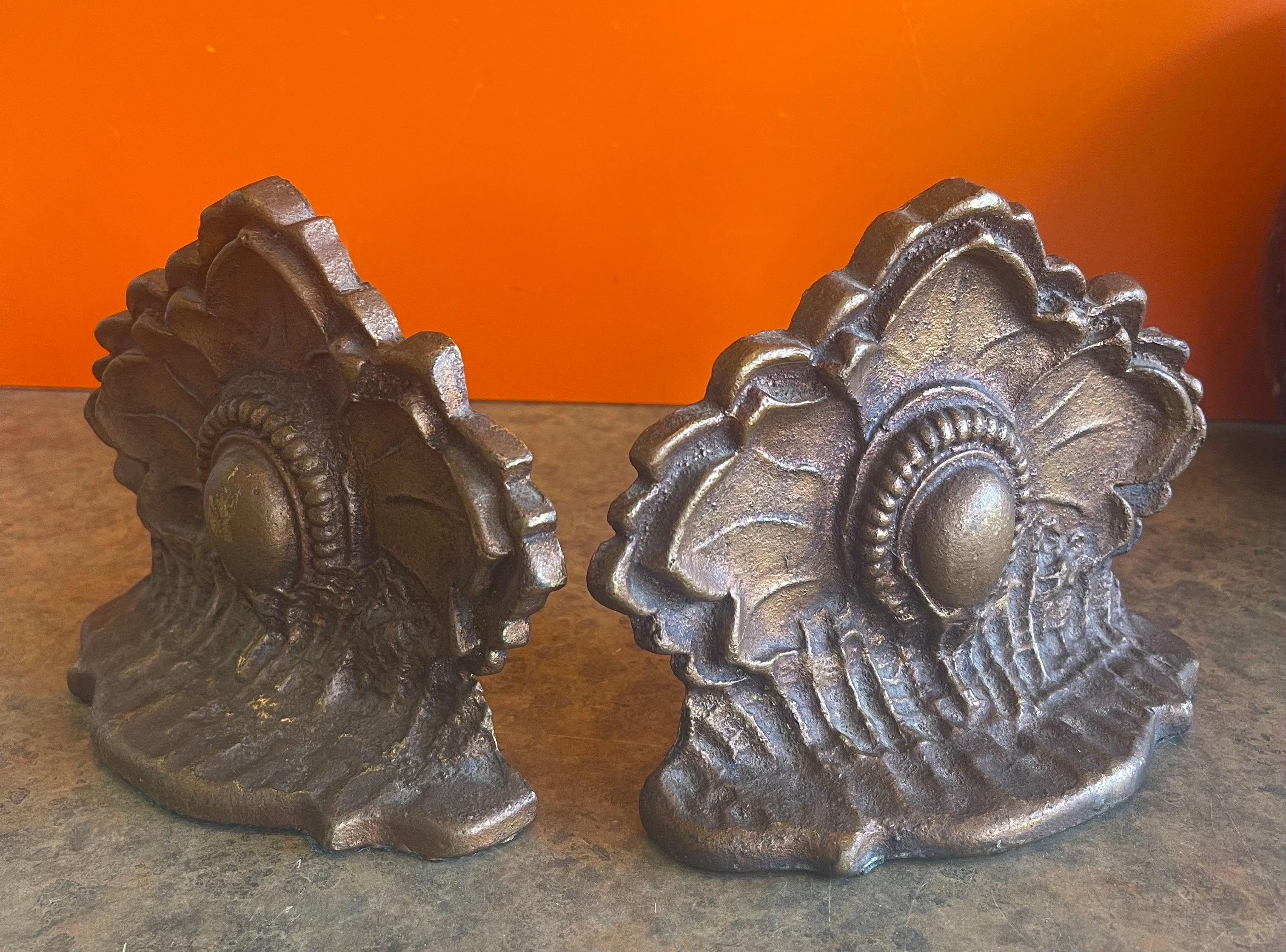 Attractive pair of cast metal Art Deco bookends, circa 1940s. They are in original condition with a nice patina and measure 4