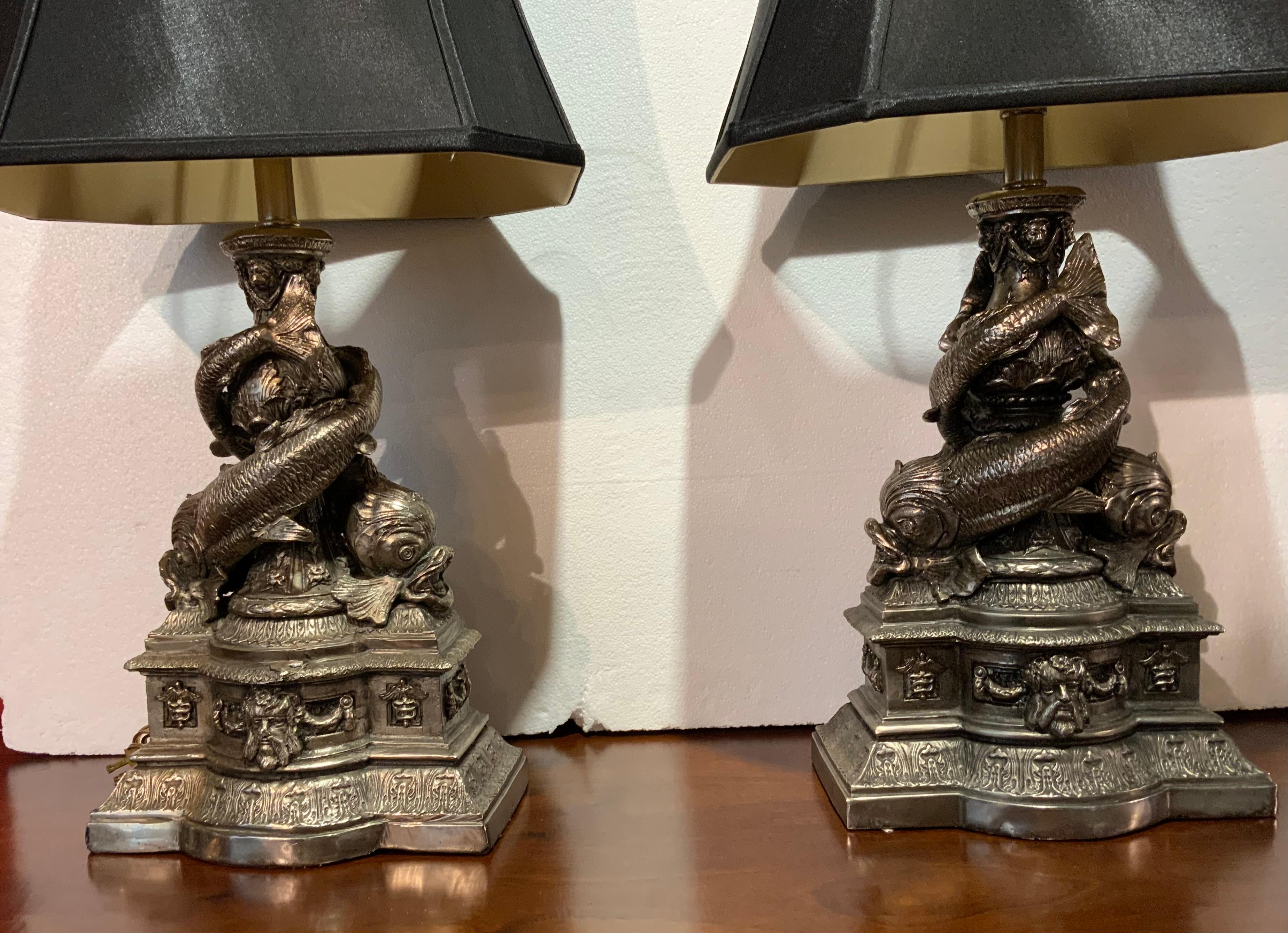 French Pair of Cast Metal Lamps with Intertwined Dolphins in a Pewter Hue For Sale