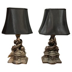 Pair of Cast Metal Lamps with Intertwined Dolphins in a Pewter Hue