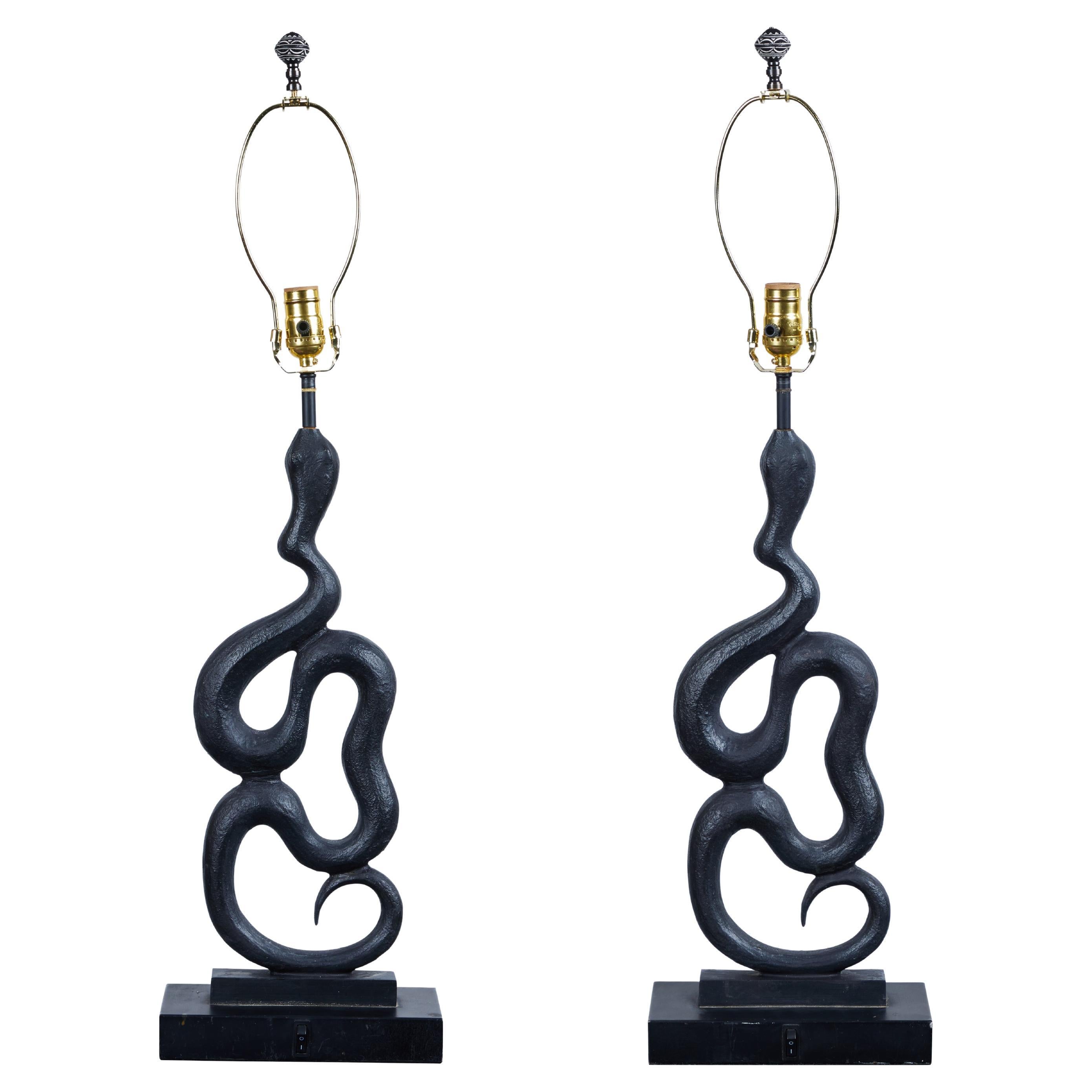 Incredibly chic pair of cast metal serpent lamps, France, circa 1970's. Lamps have been newly re-wired. Lamp shades can be custom ordered seperately.