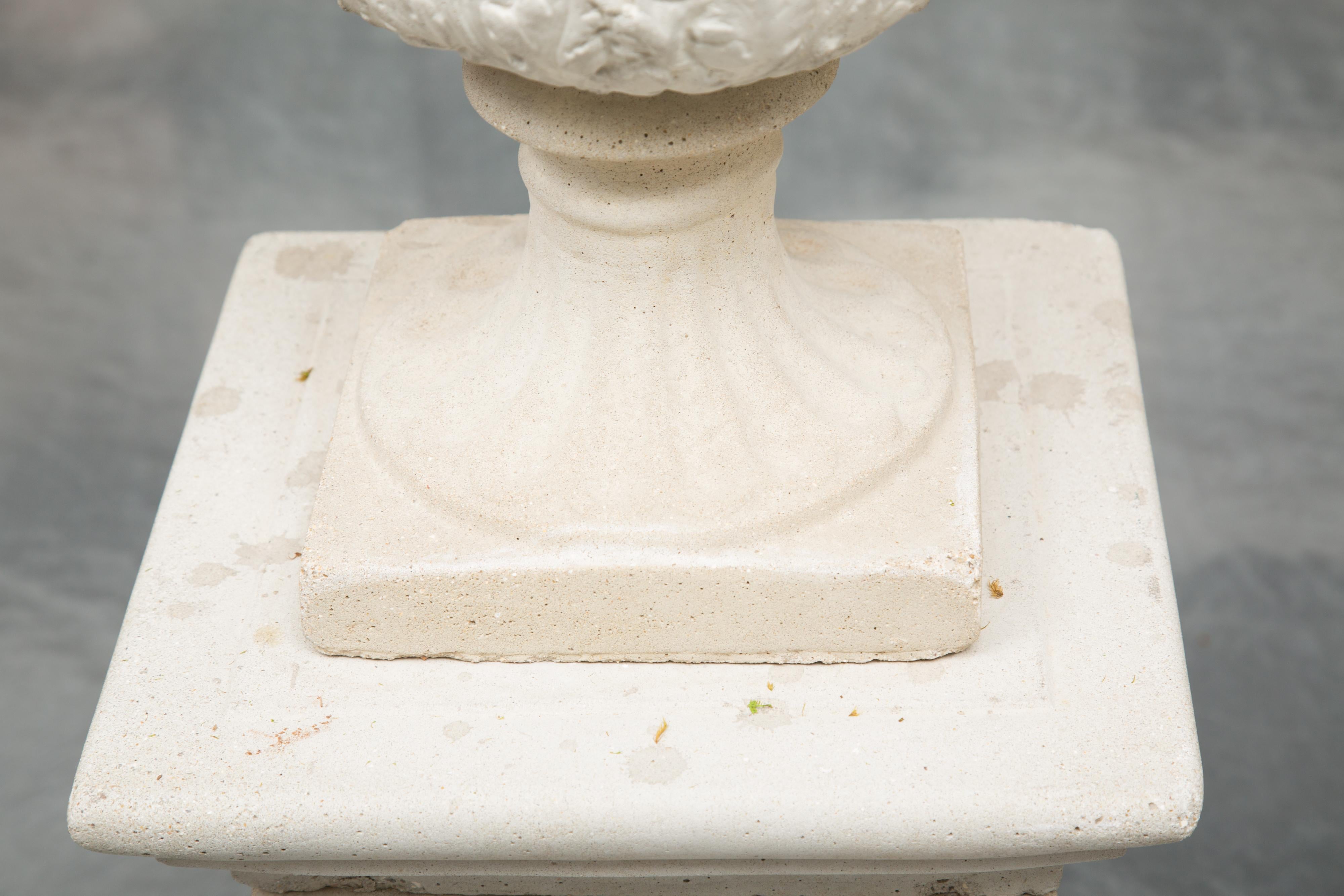 Cast Stone Pair of Cast Neoclassical Urns on Plinths