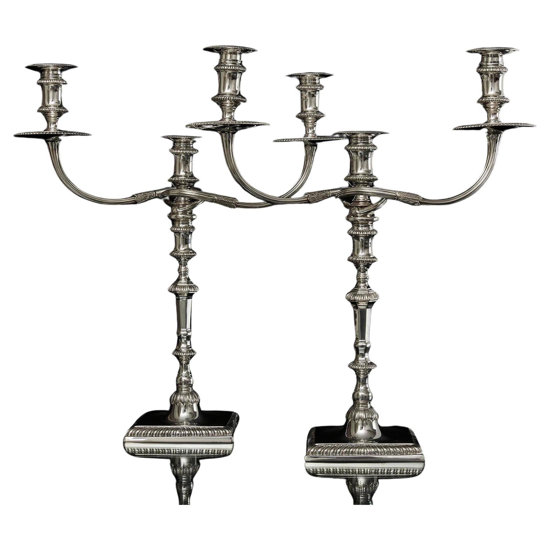 Pair of cast sterling silver candelabra