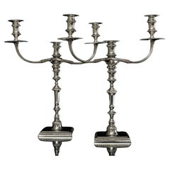 Pair of cast sterling silver candelabra