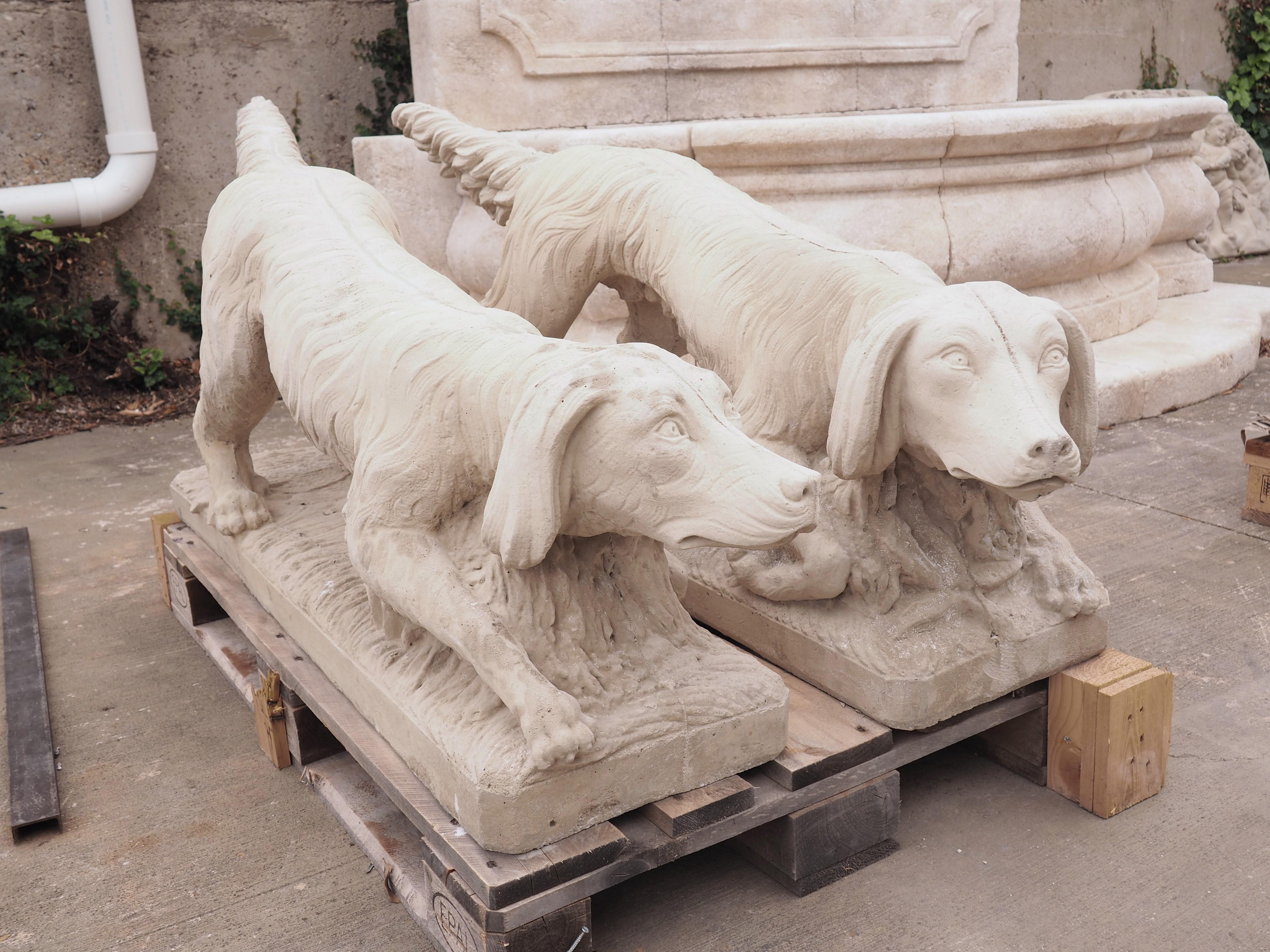 French Pair of Cast Stone Dog Statues in a Light Sandstone Finish