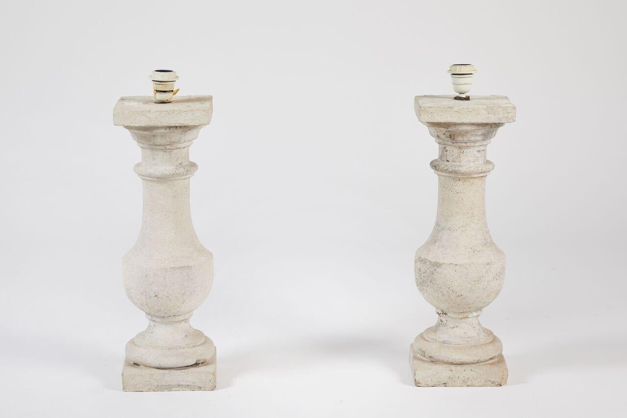 Pair of cast stone lamps.

Measures: 21