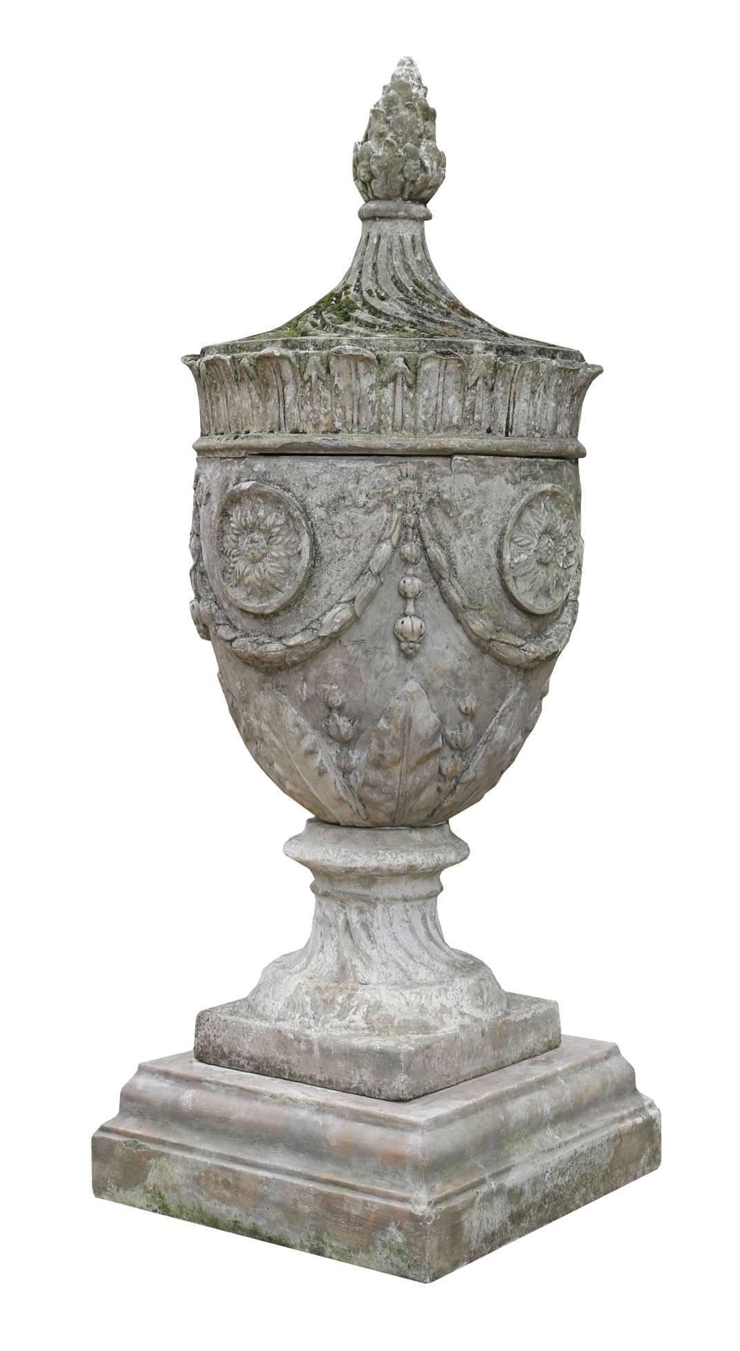 Each of the urns are three pieces, they are well weathered with some old repairs.
A copy of the late 18th century Coade design.
Weight 170 kg each.