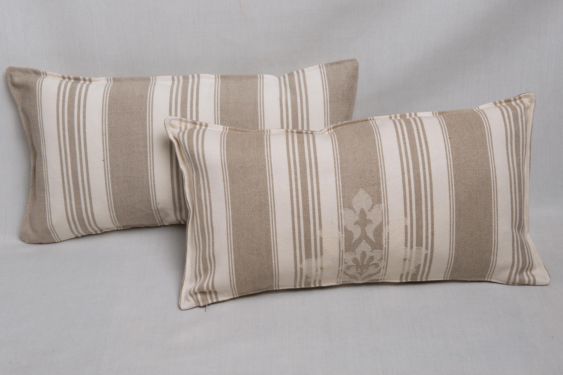 B/2443 -  Pair of casual long pillows in un-dyed cotton. One time this tissue was used in Italy for matresses, so it is called mattress linen. It is simple and robust, it has an innate elegance of old tradition.