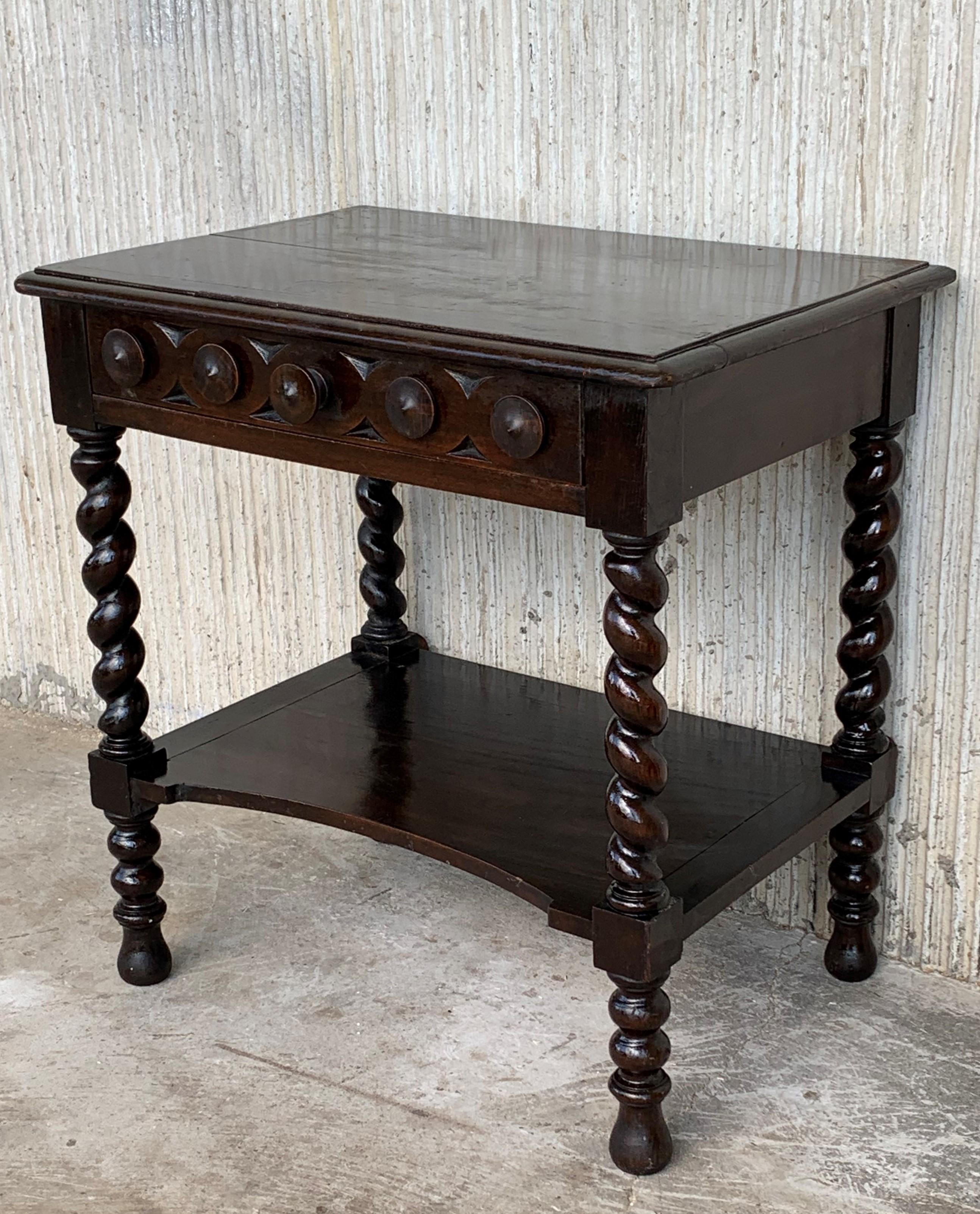 20th century pair of Catalan, Spanish nightstands with carved drawer and open shelf
The tables are made of a walnut of this region 
Beautiful and heavy nightstands.
 