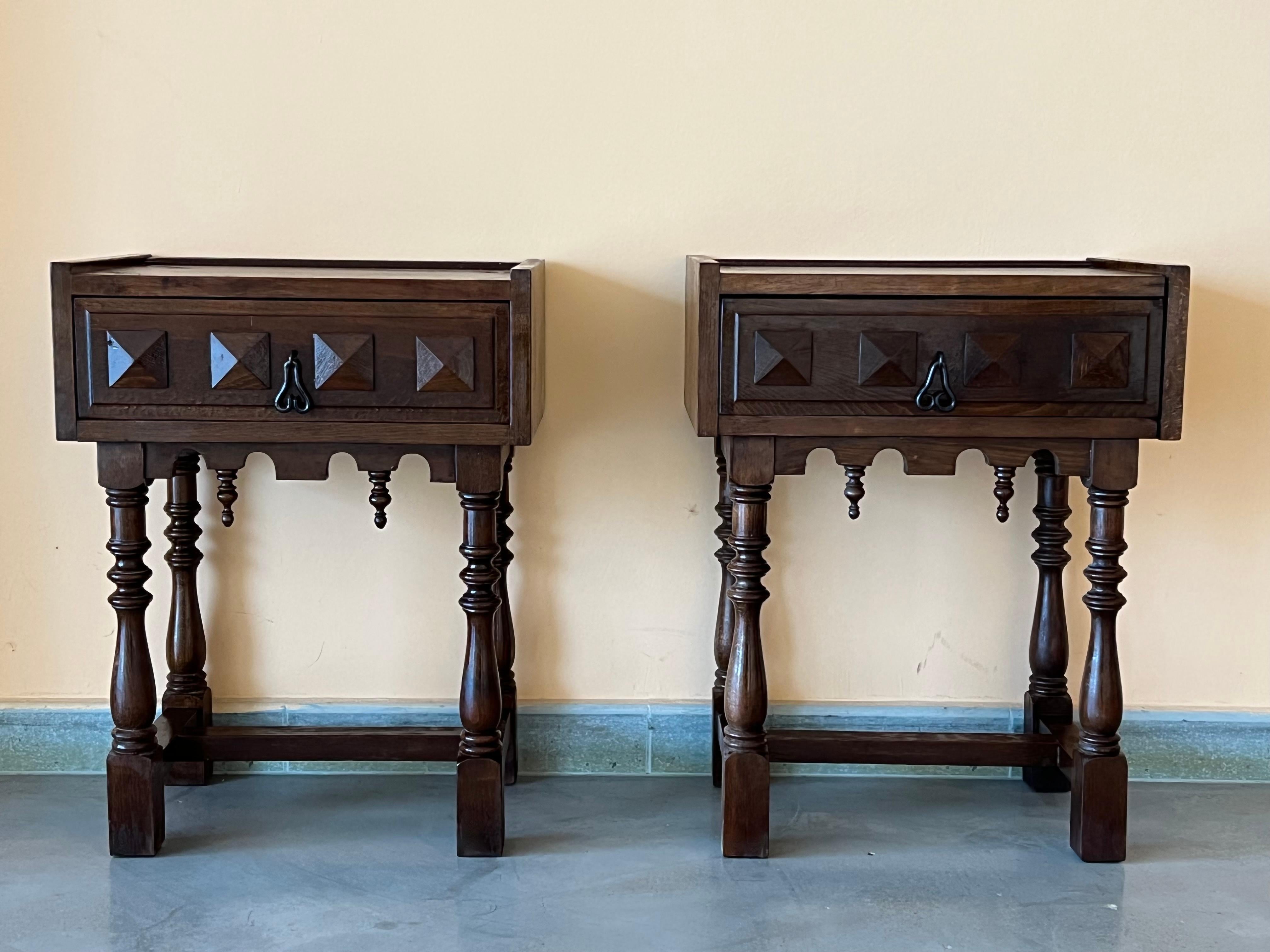 20th century pair of Catalan, Spanish nightstands with carved bars in both sides and one drawer.
The tables are made of walnut of this region
Beautiful and heavy nightstands.
  
