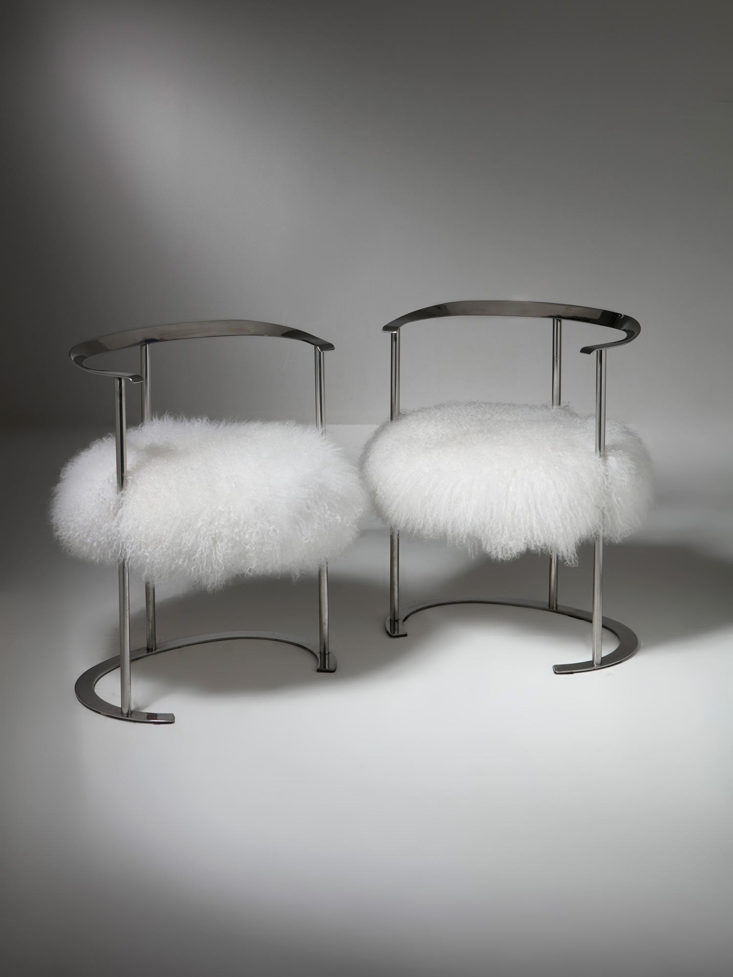 Set of two Catilina chairs by Luigi Caccia Dominioni for Azucena.
Mohair cover supported by a chrome frame.