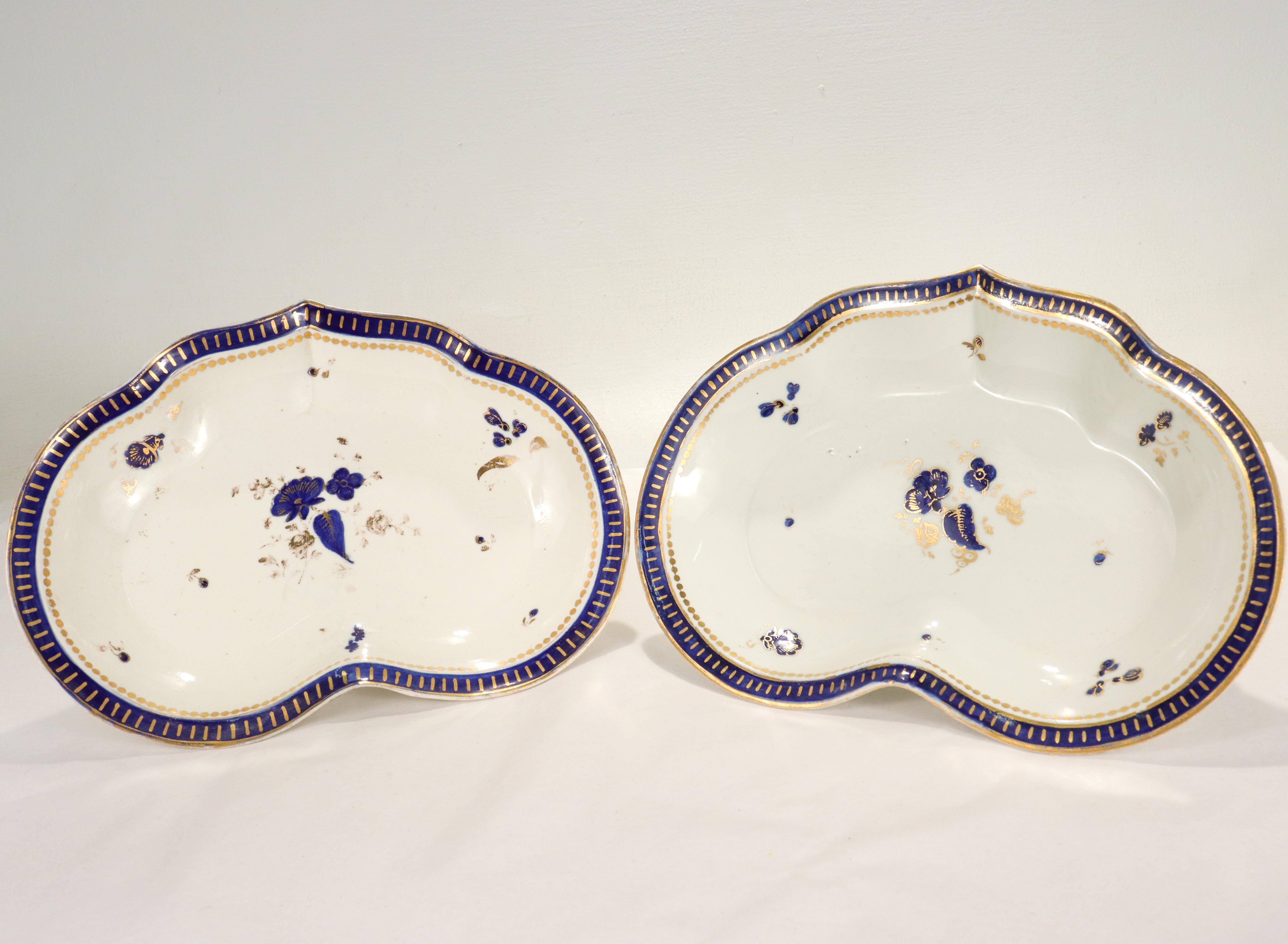 A fine pair of English porcelain shaped bowls or dishes.

By Caughley.

In a heart-form or shield shape.

Decorated throughout with painted cobalt blue and gilt floral devices. The rim is decorated with geometric devices in the same