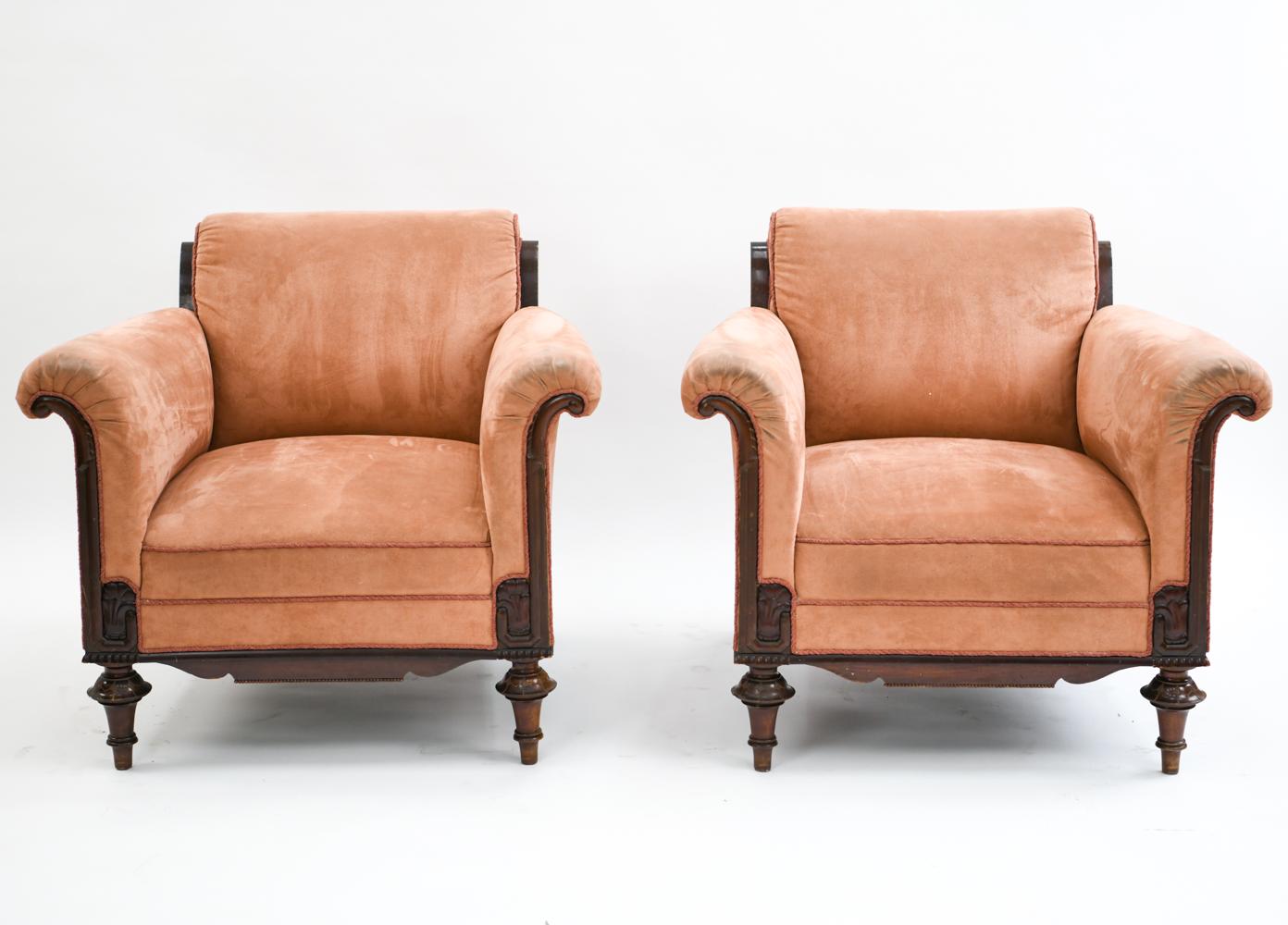 This Classic pair of lounge chairs were manufactured by C.B. Hansen, circa 1930s. The design is attributed to Johan Rohde and features curved arms with carved wooden frames.