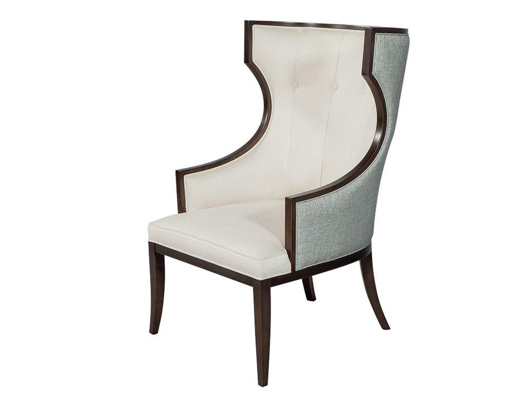 Very sophisticated and regal show wood wing chairs. The frame is made in Italy from solid beech wood, and custom finished in Espresso walnut at Carrocel. Upholstered with designer fabric, the outside is a shimmering blue woven fabric and the inside