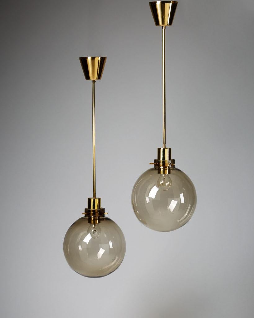 Pair of ceiling lamps designed by Hans-Agne Jakobsson, Sweden, 1960s.
Glass and brass.