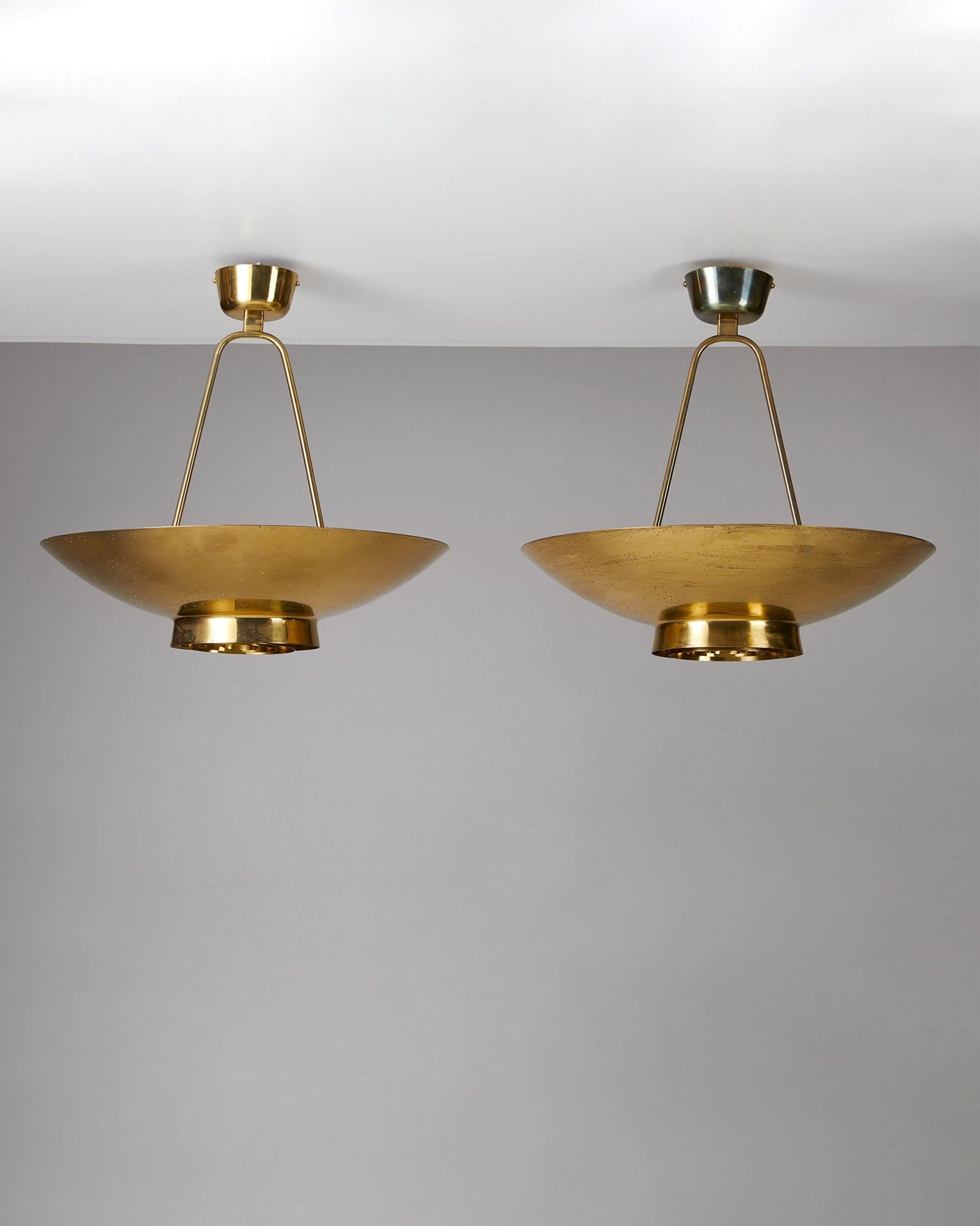 Pair of ceiling lamps model 9060 designed by Paavo Tynell for Taito Oy, Finland, 1950s.
Brass.

This model was designed for the secretariat's room at the United Nations, NYC, USA.

Measures: H 53 cm/ 20 7/8