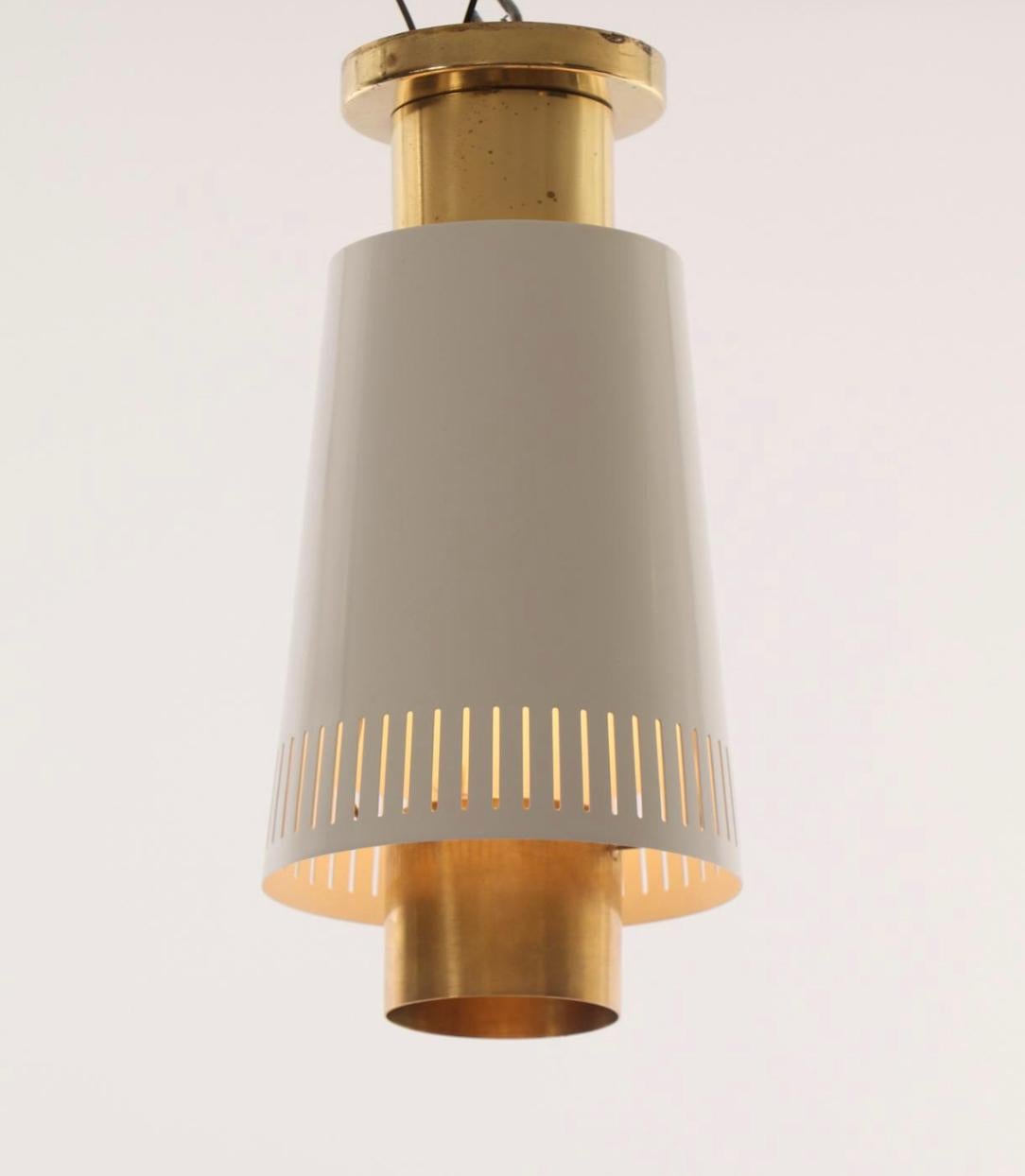 Pair of flush mount ceiling lights designed by Paavo Tynell, Model 9067. Finland, circa 1950.
Polished brass and lacquered metal. One marked Taito and second marked Idman.
Existing electrical wiring, rewiring available upon request.