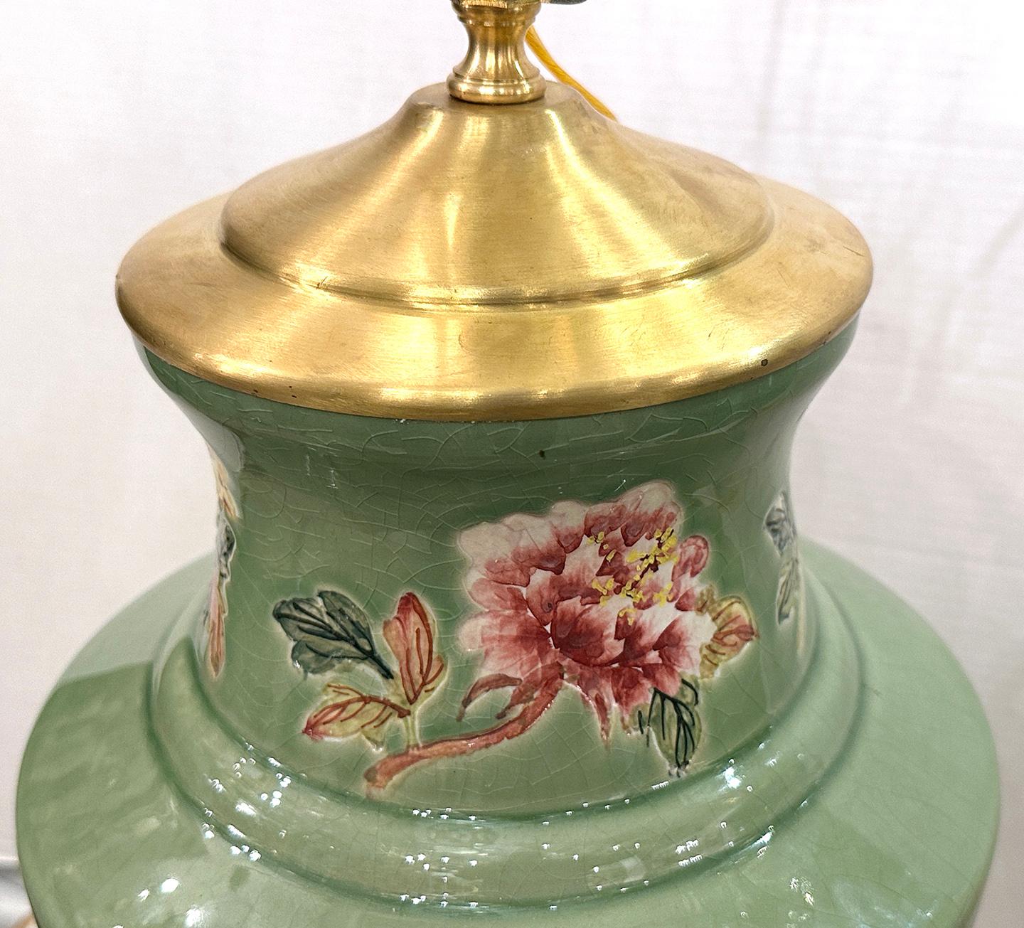 Pair of circa 1950's Chinese celadon floral lamps with floral decoration.

Measurements:
Height of body: 18