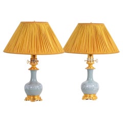 Pair of Celadon porcelain and gilded bronze lamps. Circa 1880.