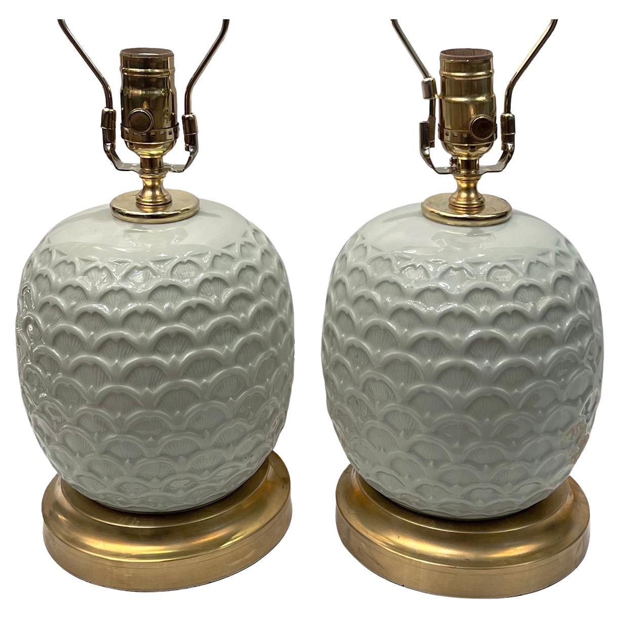 Pair of circa 1920s French celadon table lamps.

Measurements:
Height of body: 9.75?
Height to shade rest:17.75?
Diameter: 6.5?.