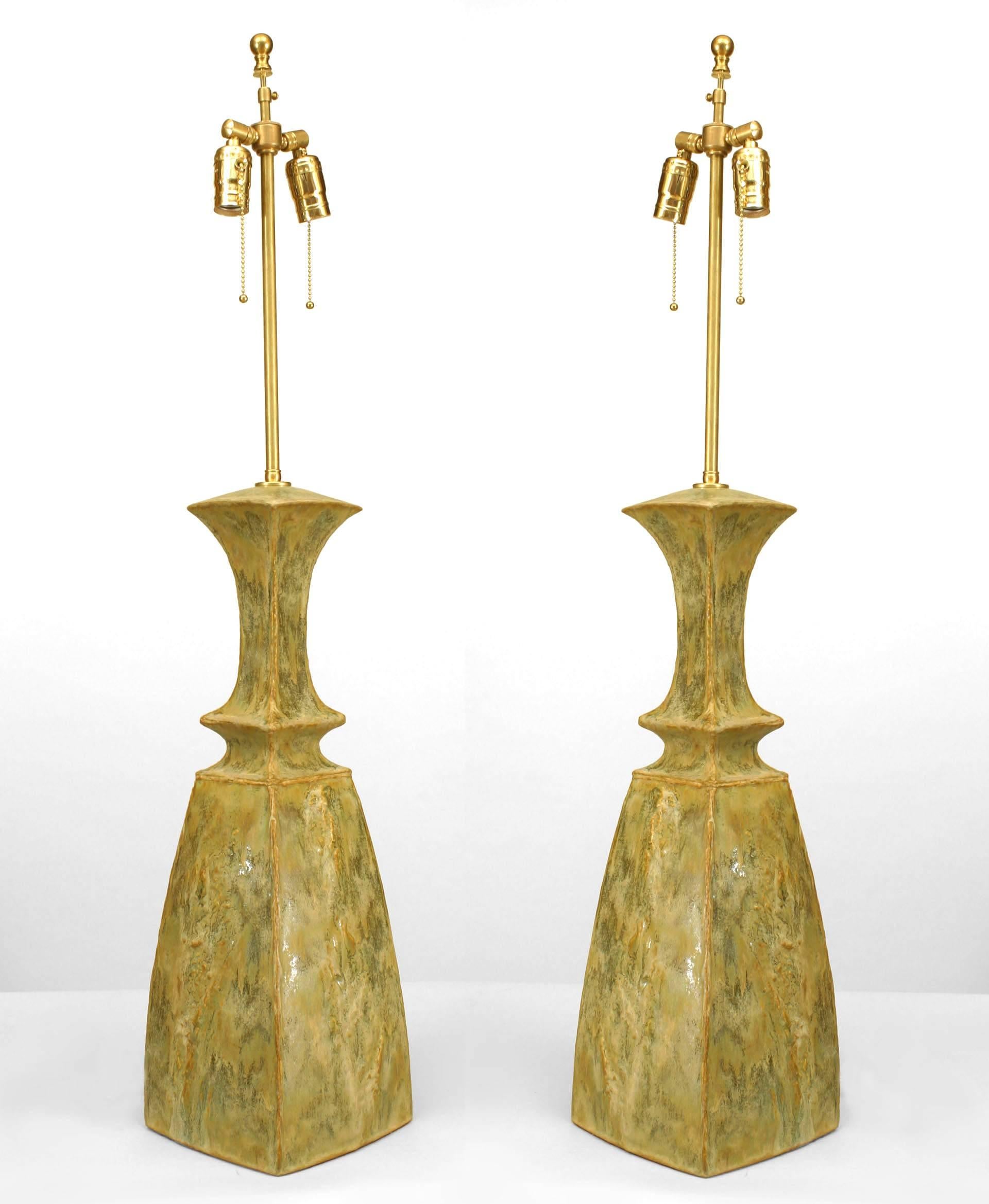 Pair of American Post War Design celadon glazed ceramic textured relief vases mounted as lamps with a tapered neck. (signed: GARY DIPASQUALE)(PRICED AS Pair).

