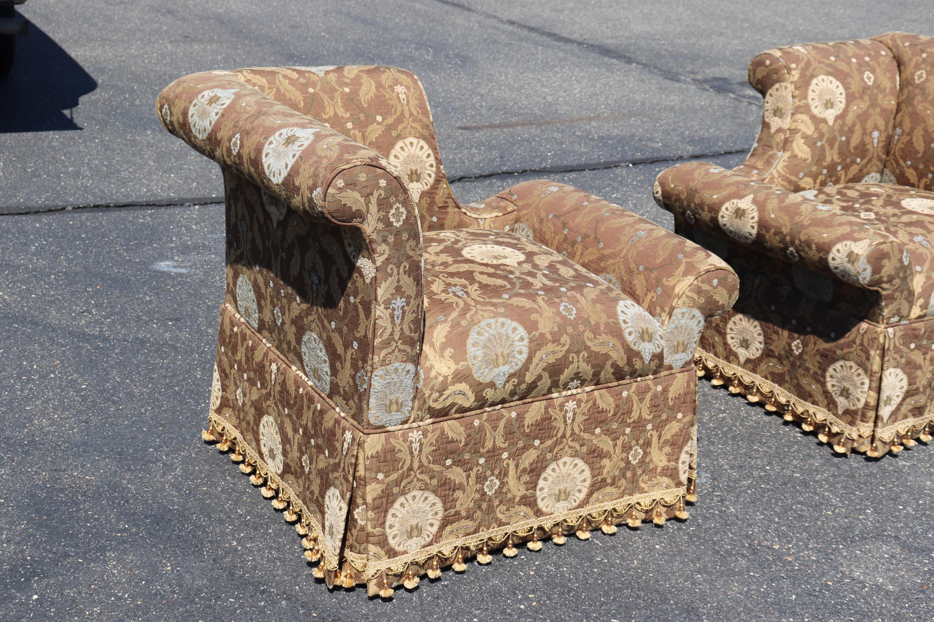 This is a beautiful pair of Century Furniture corner club chairs. They are upholstered in beautiful and clean upholstery with very, very little if any signs of use. The chairs are done in a hollywood regency or contemporary style. They are from the