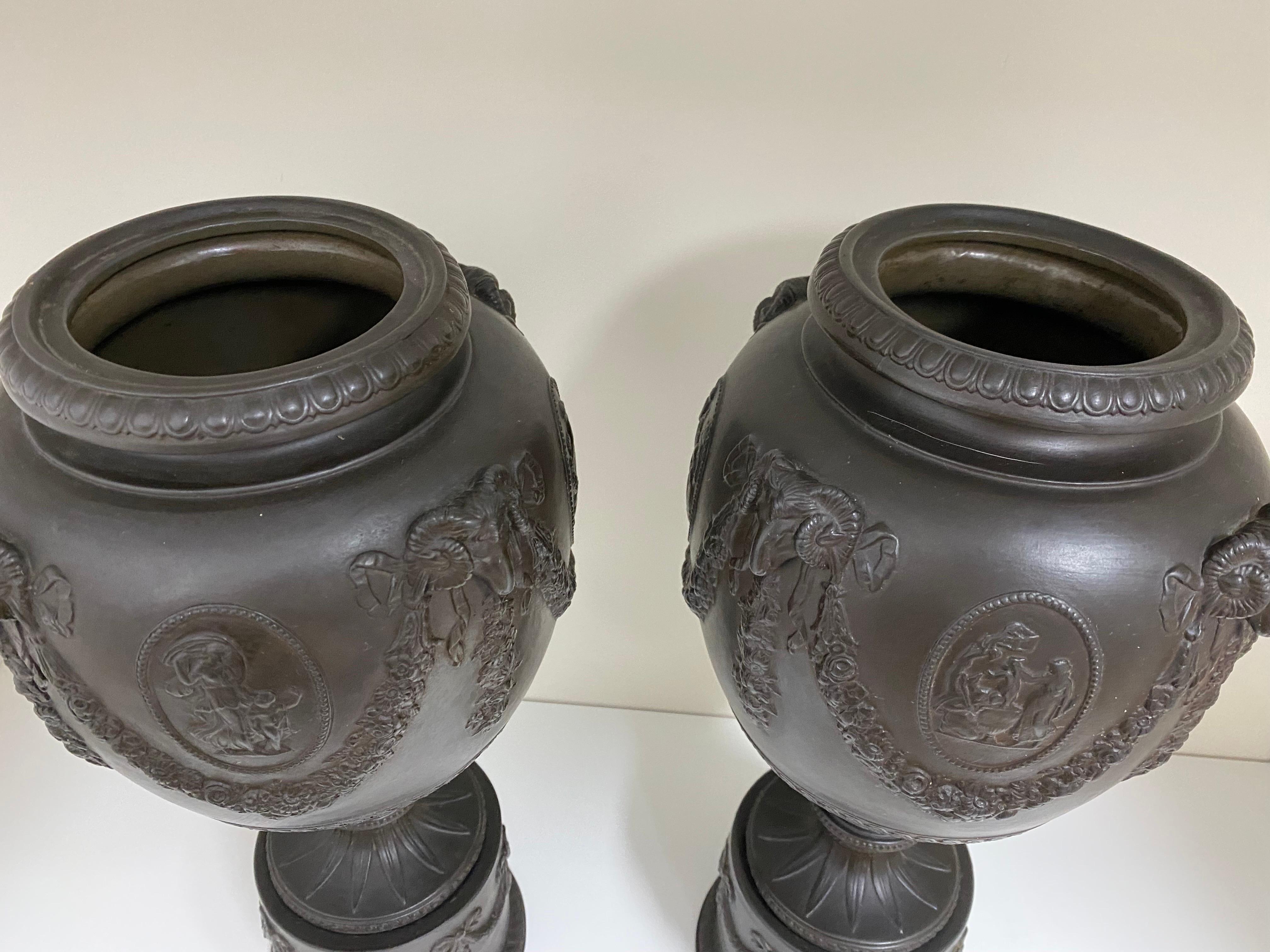 English Pair of Ceramic Basalt Relief Urns Attributed to Wedgwood For Sale