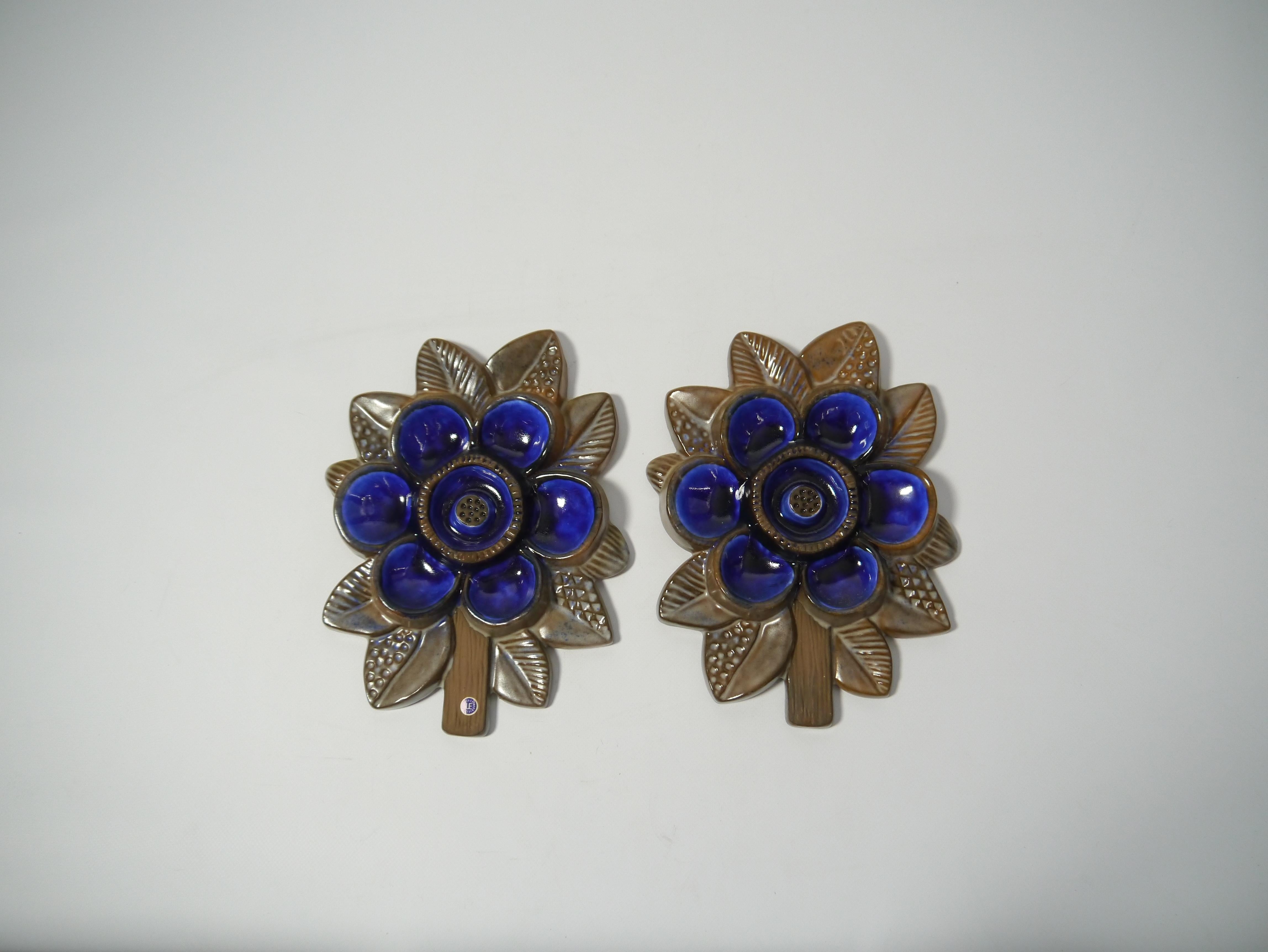 A pair of glazed ceramic flower wall plaques, made by ceramist Irma Yourstone for Upsala Ekeby, Sweden, 1970s.