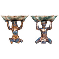 Pair of Ceramic Compotes Depicting Kneeling Figures Holding Shallow Bowls