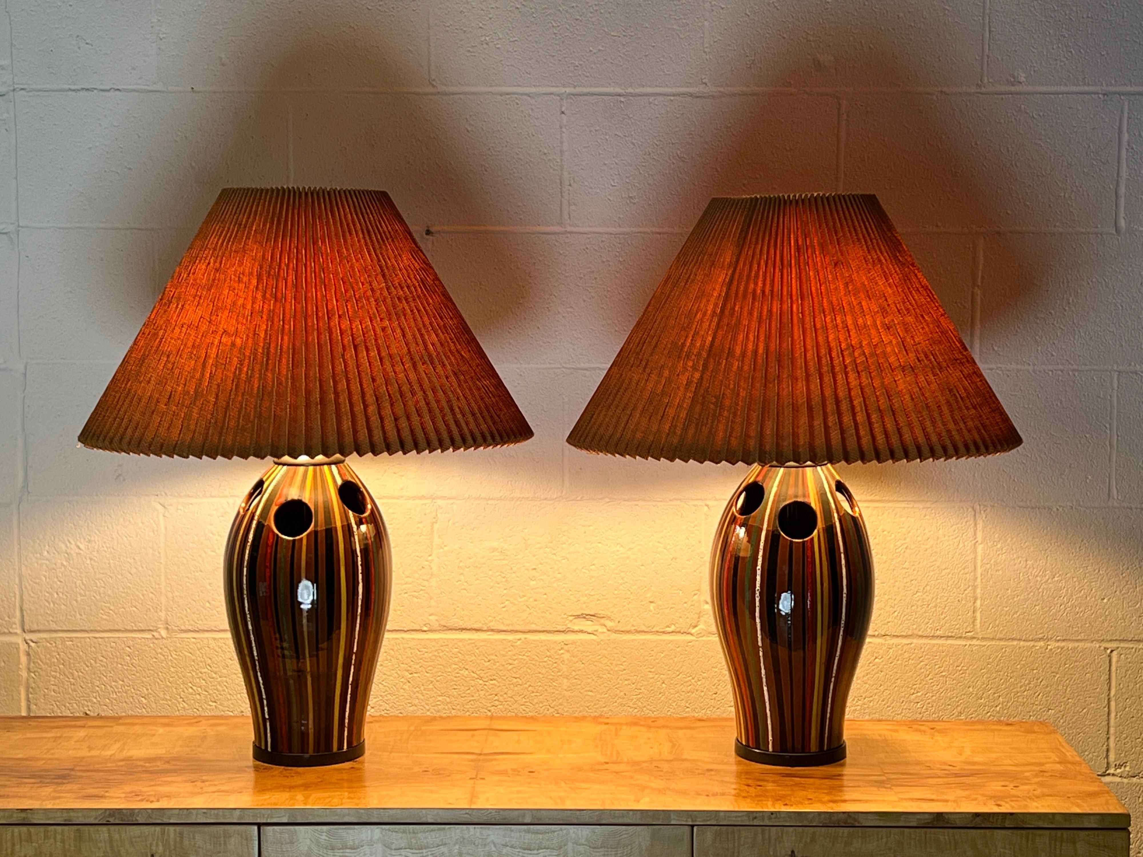 A beautiful pair of Italian Bitossi ceramic lamps with bronze hardware and original shades.