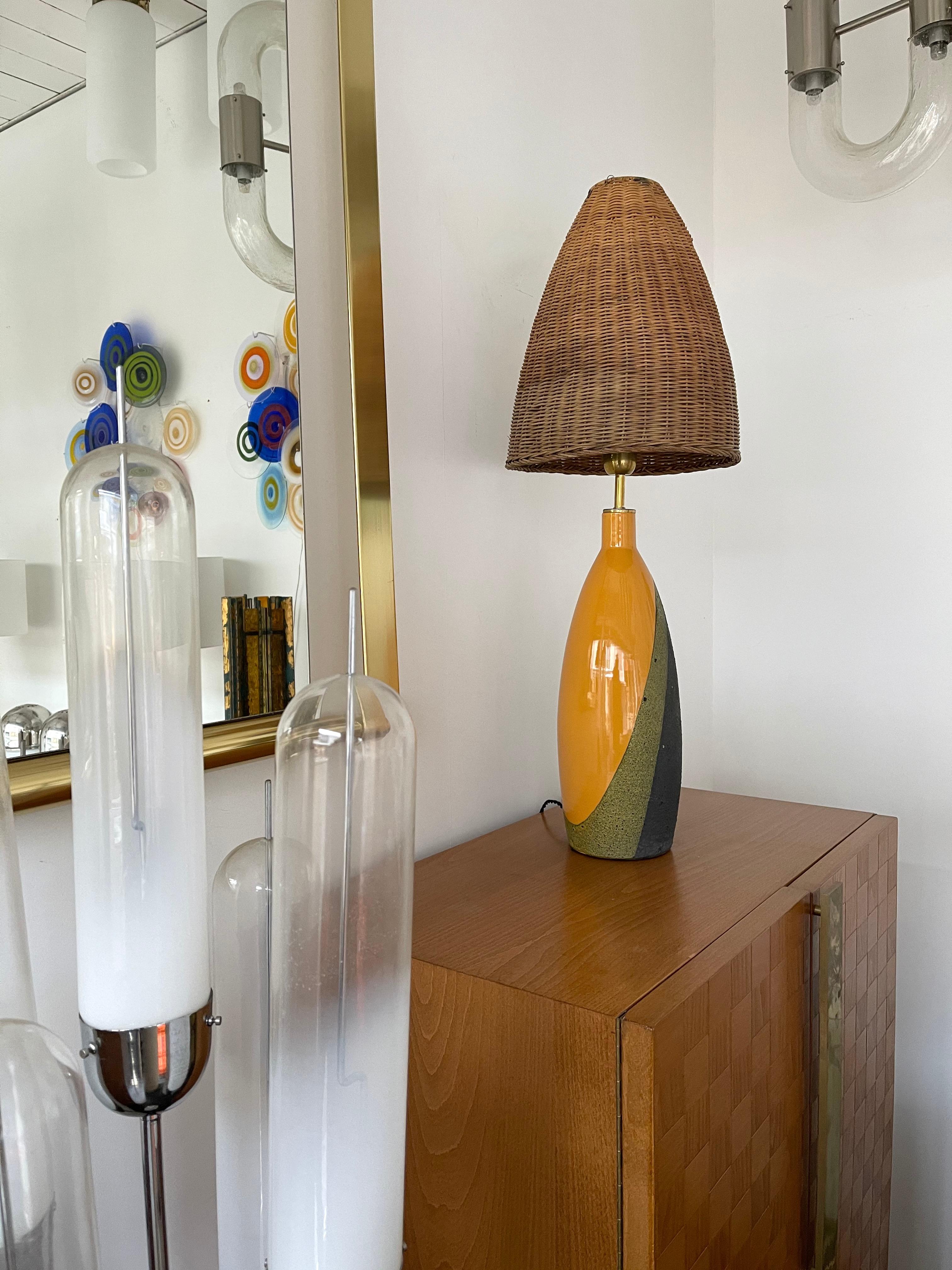 Pair of table or bedside lamps in ceramic terracotta by Ettore Sottsass for the Italian manufacture Bitossi, typical client reference under the lamps from the manufacture. Nice original rattan wicker shades. Famous design like Gambone, Franco Bucci,