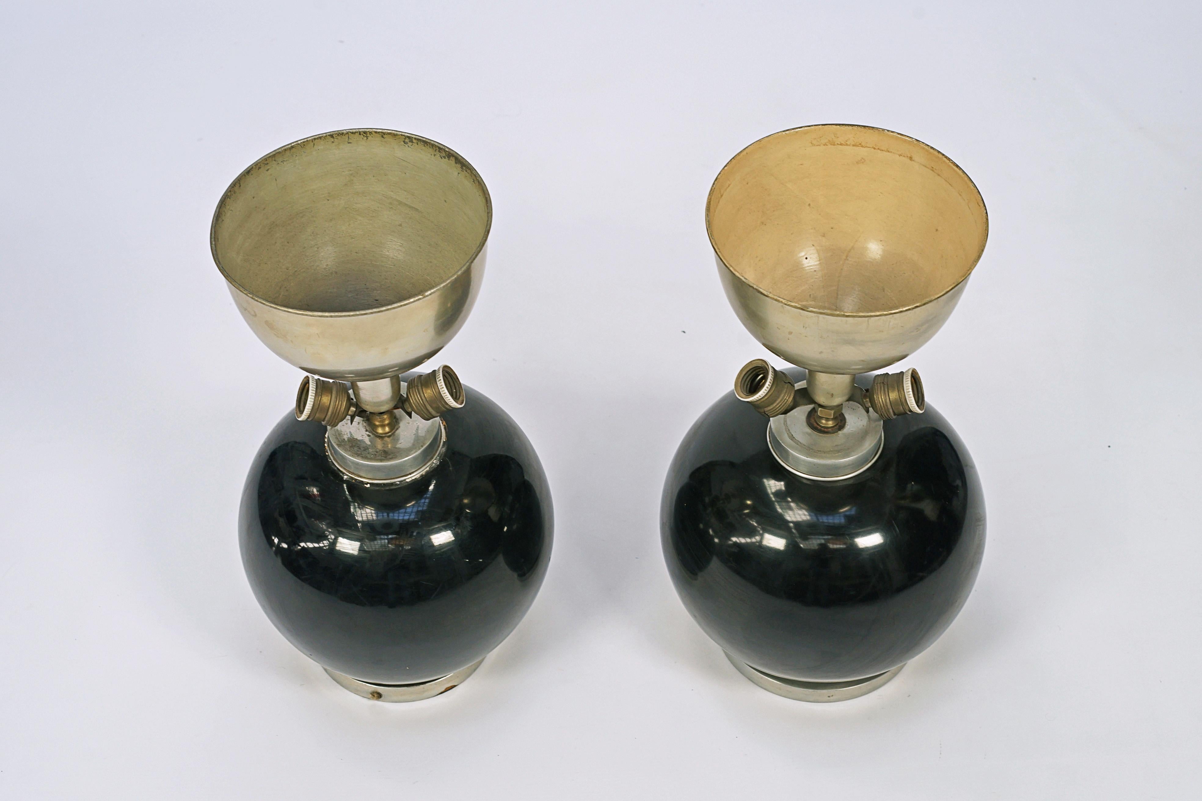 Pair of ceramic lamps designed by Maison Jansen. Black ceramic and metal base.

France, CIRCA 1940.