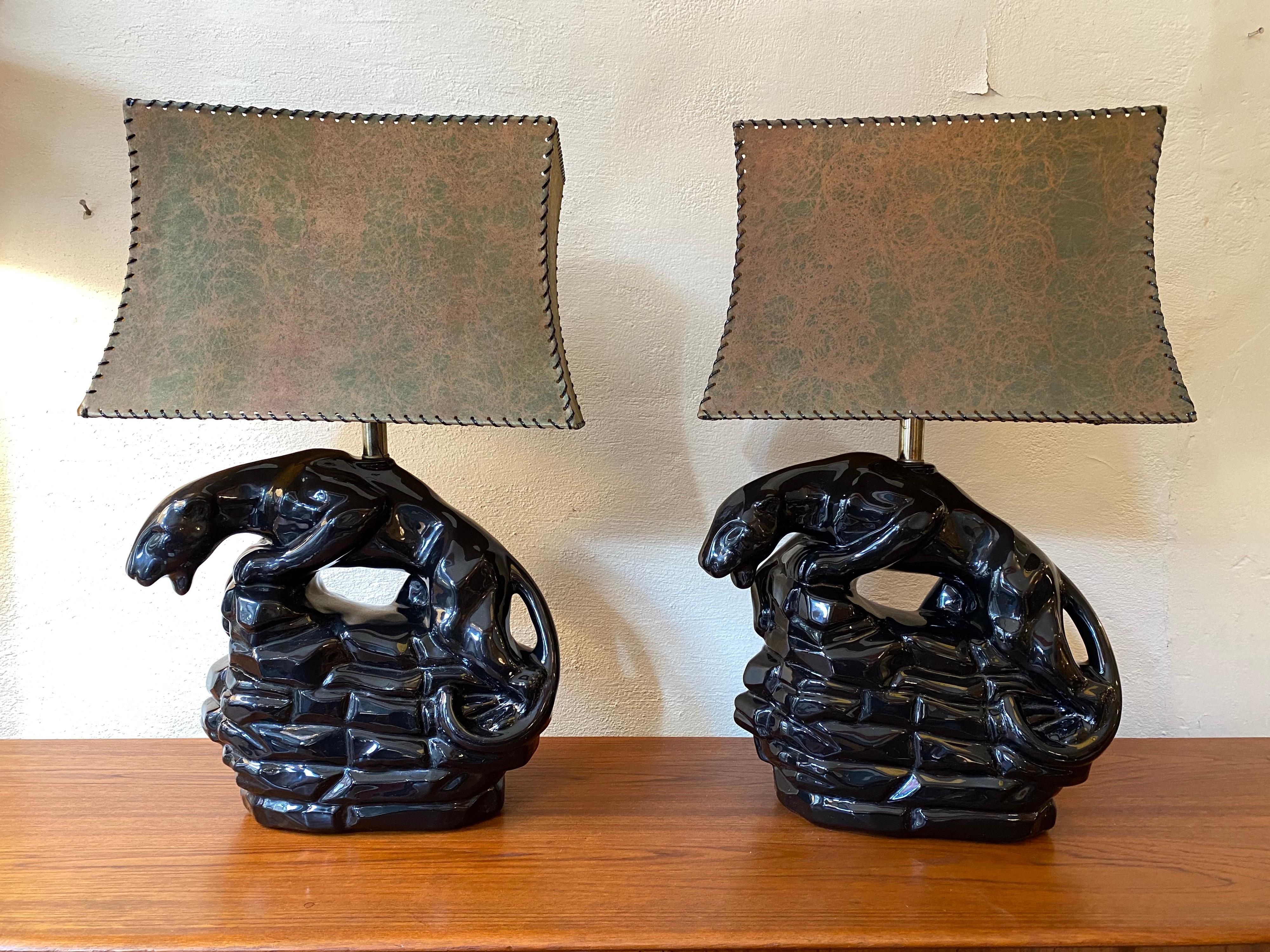 Pair of ceramic black panther table lamps with fiberglass lampshades. Lamps in great shape, fiberglass shades have had the gimp replaced and look great! Nice scale and size! Ceramic very nice condition!