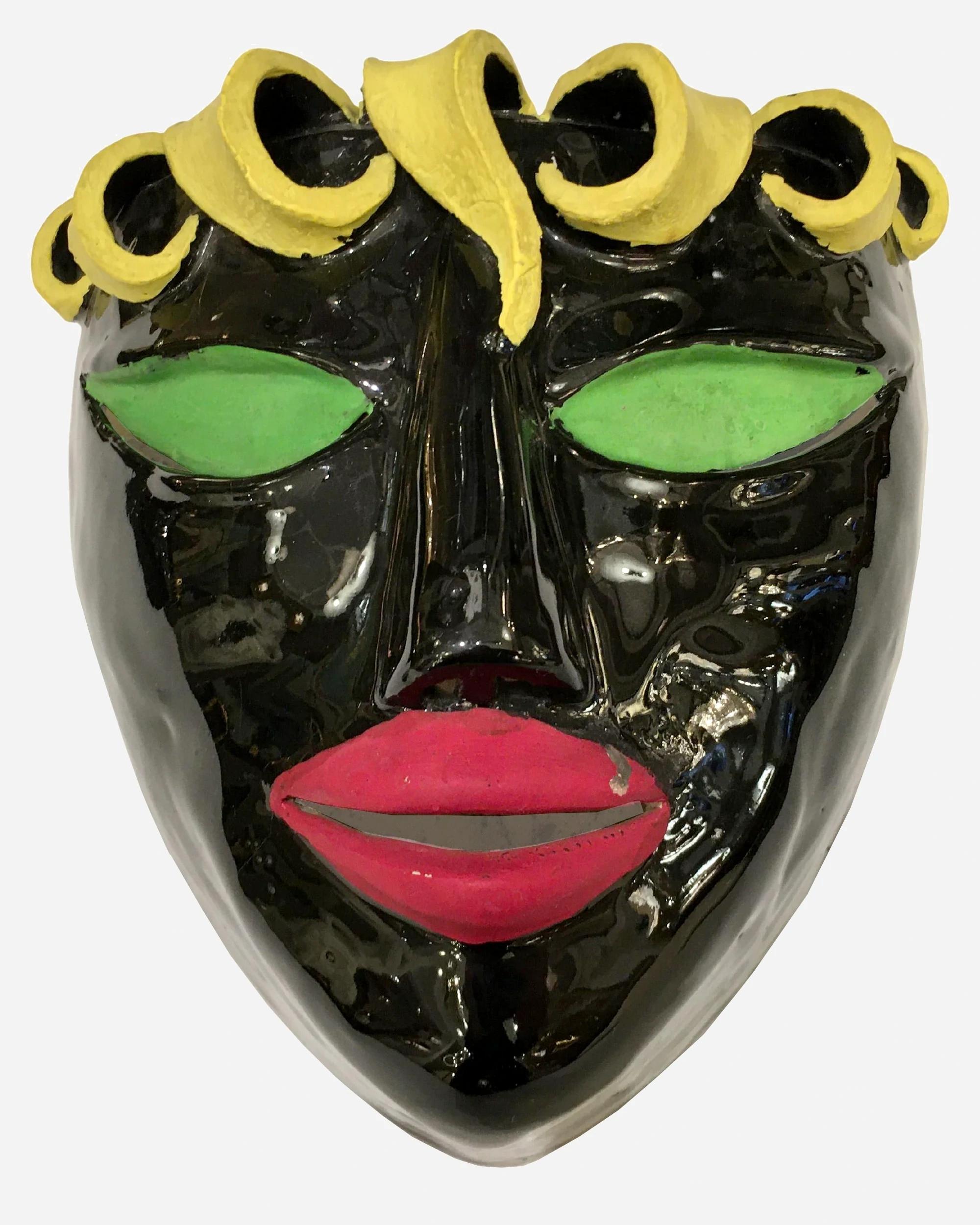 Two amusing glazed ceramic sconces featuring two masks.
Light emerges from the top, mouth and eyes of each sconce.
In the spirit of Colette Guéden.