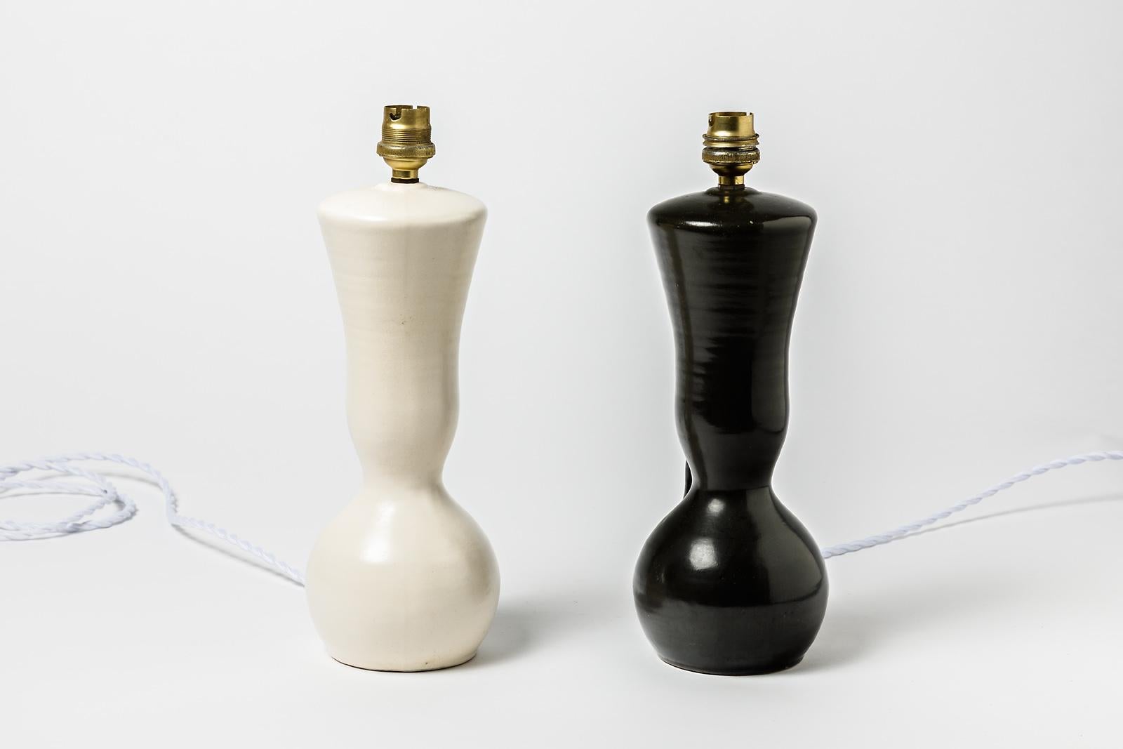 Elegant pair of black and white ceramic table lamps.

Realized circa 1950 and attributed to Pol Chambost.

Original 20th century design

Original perfect conditions. Electric system is ok.

Sold without lampshade.

Price is for the