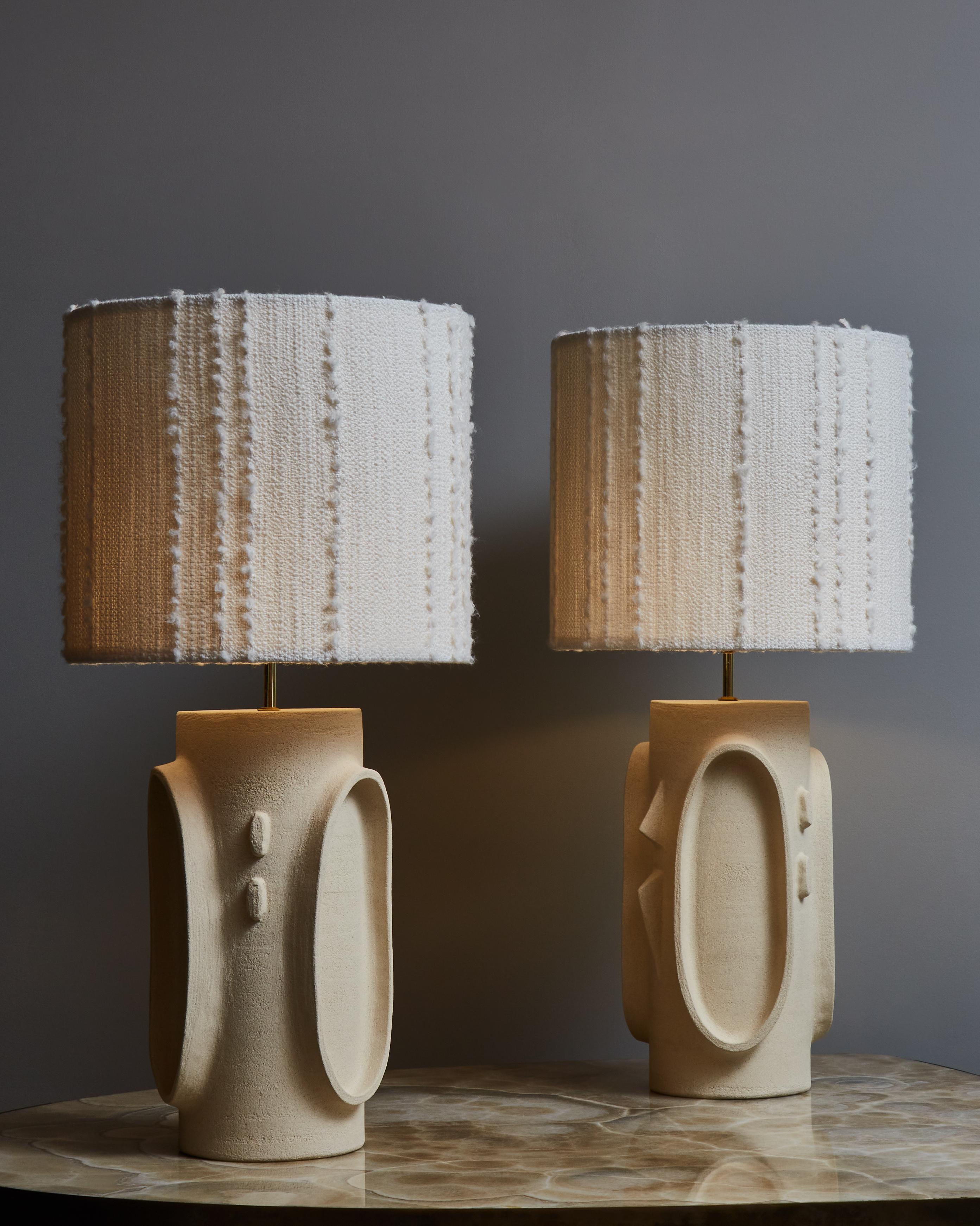 Pair of tall and elegant table lamps made in ceramic by the French artist Olivia Cognet, topped with Dedar Milano fabric lamp shades.

Since moving to Los Angeles in 2016, French artist and desi- gner Olivia Cognet has focused on ceramics as the