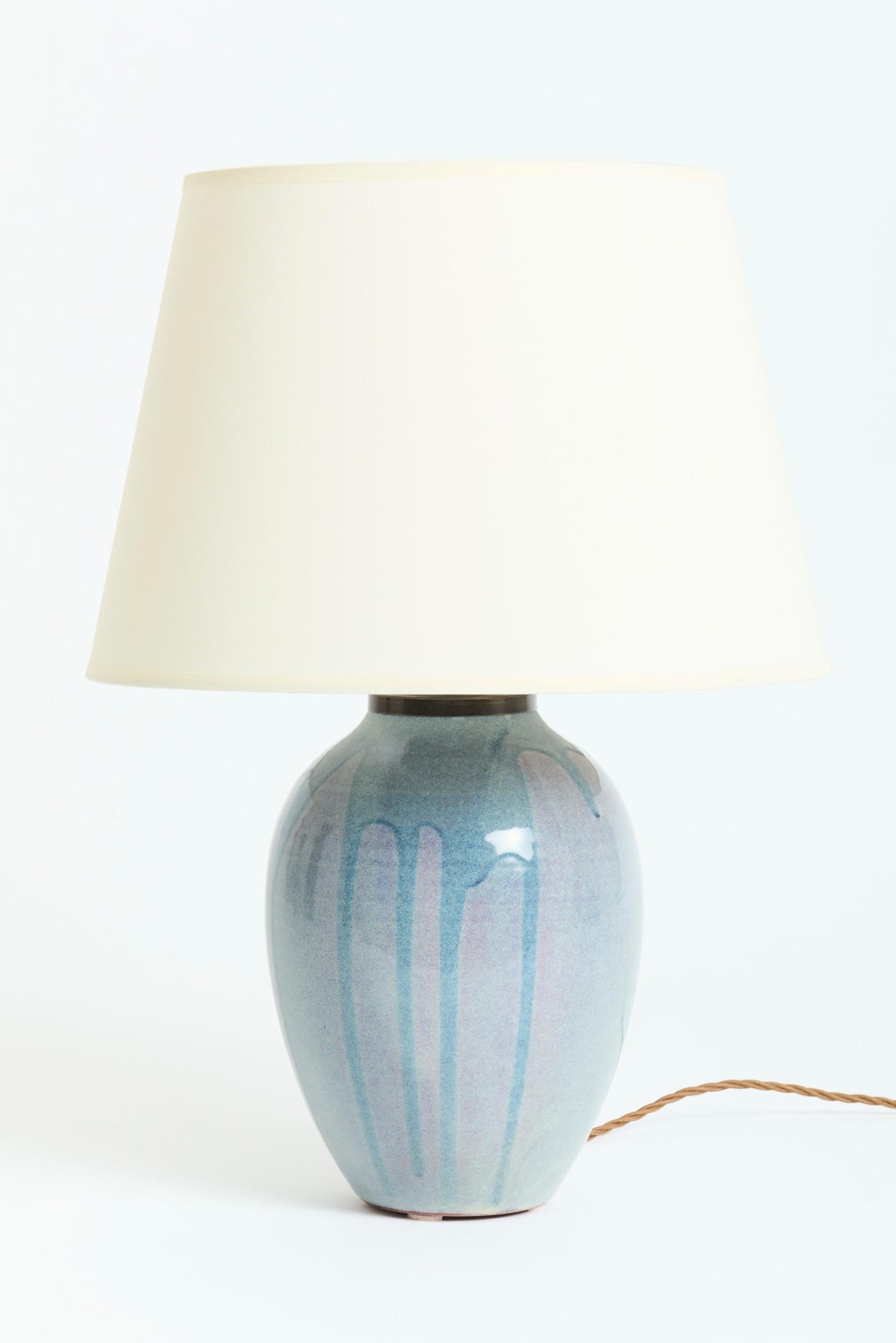 A pair of glazed stoneware table lamps
Signed Garnier
France, Circa 1900-1920
With the shades: 52 cm high by 35.5 cm diameter
Lamp base only: 34.5 cm high by 17.5 cm diameter