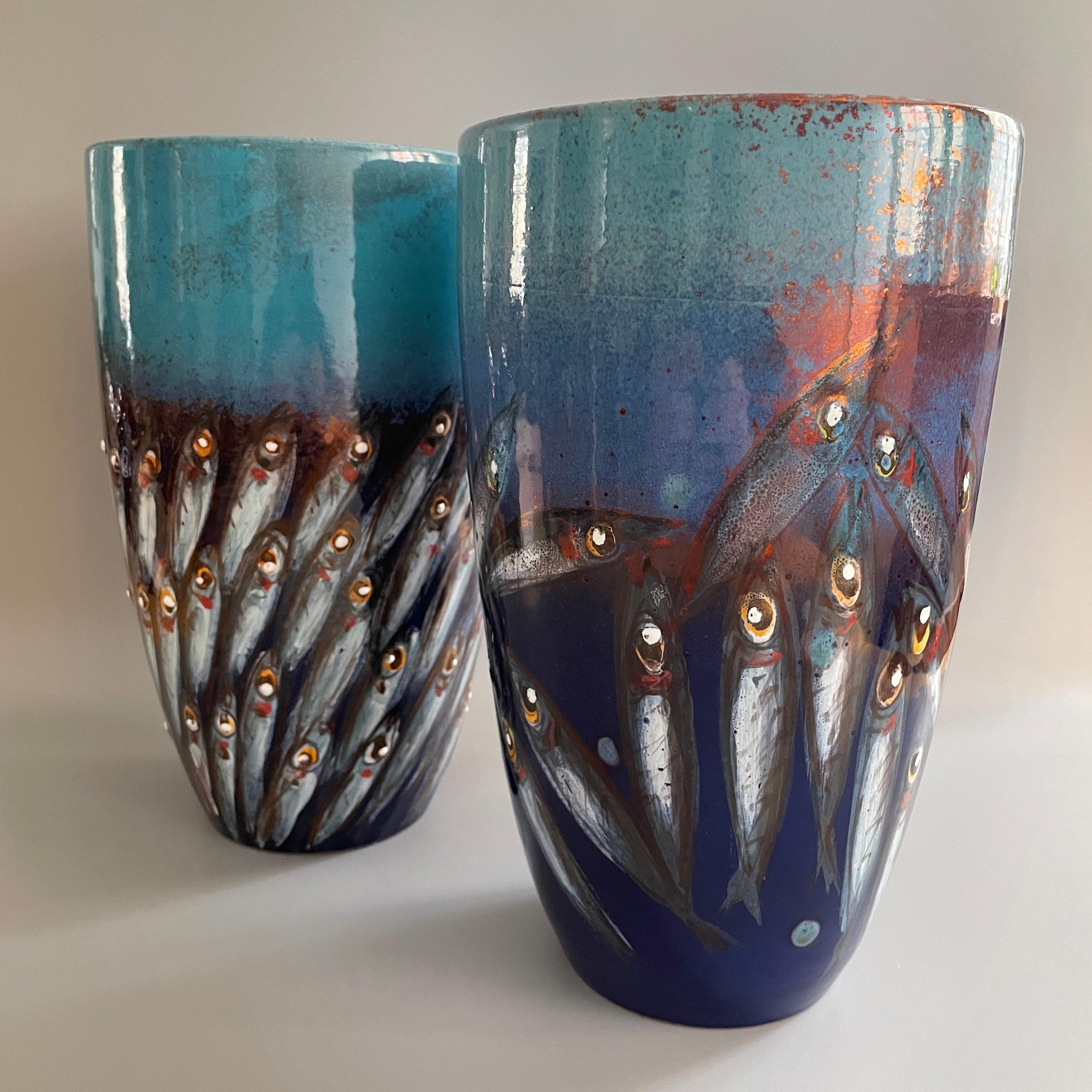 Pair of Mediterranea vases, 2020, full-fire reduction faience earthenware hand-painted with copper lustre 12cm diameter 25 cm height, hand painted unique pieces.

Bottega Vignoli is a brand of artistic ceramics based in Faenza, one of the most