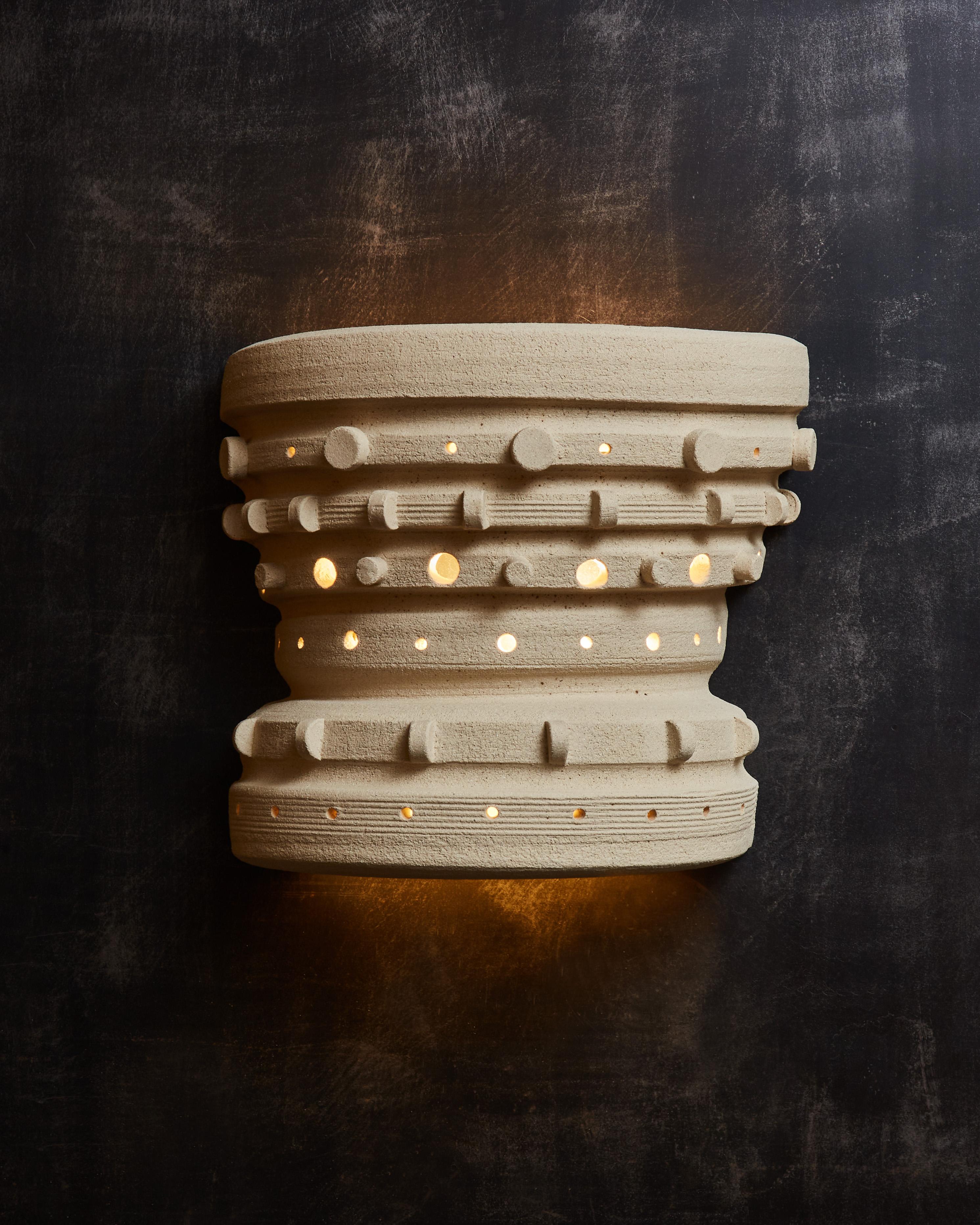 Crown shaped ceramic wall sconces made by the French artist Olivia Cognet.
Since moving to Los Angeles in 2016, French artist and desi- gner Olivia Cognet has focused on ceramics as the fertile medium through which she expresses her boundless